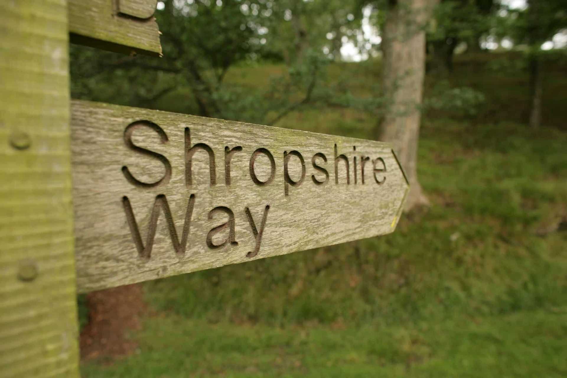 Wooden sign directing to the Shropshire Way
