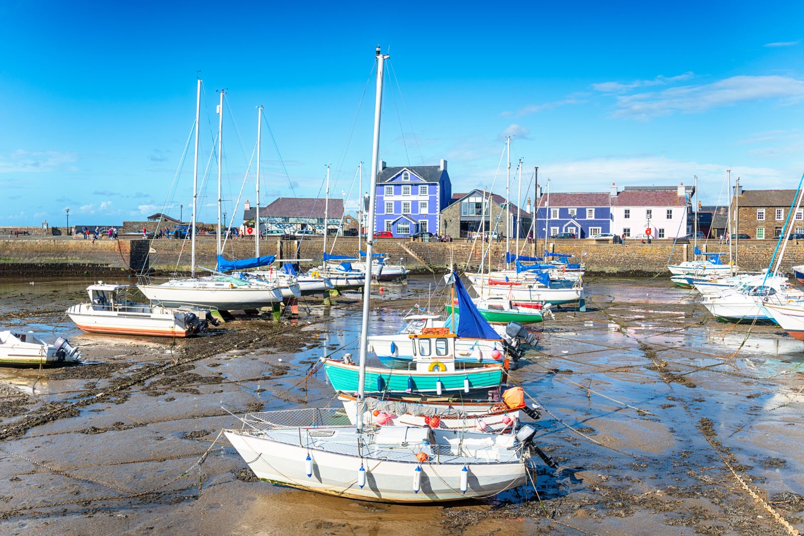 Boats in Aberaeron harbour at low tide