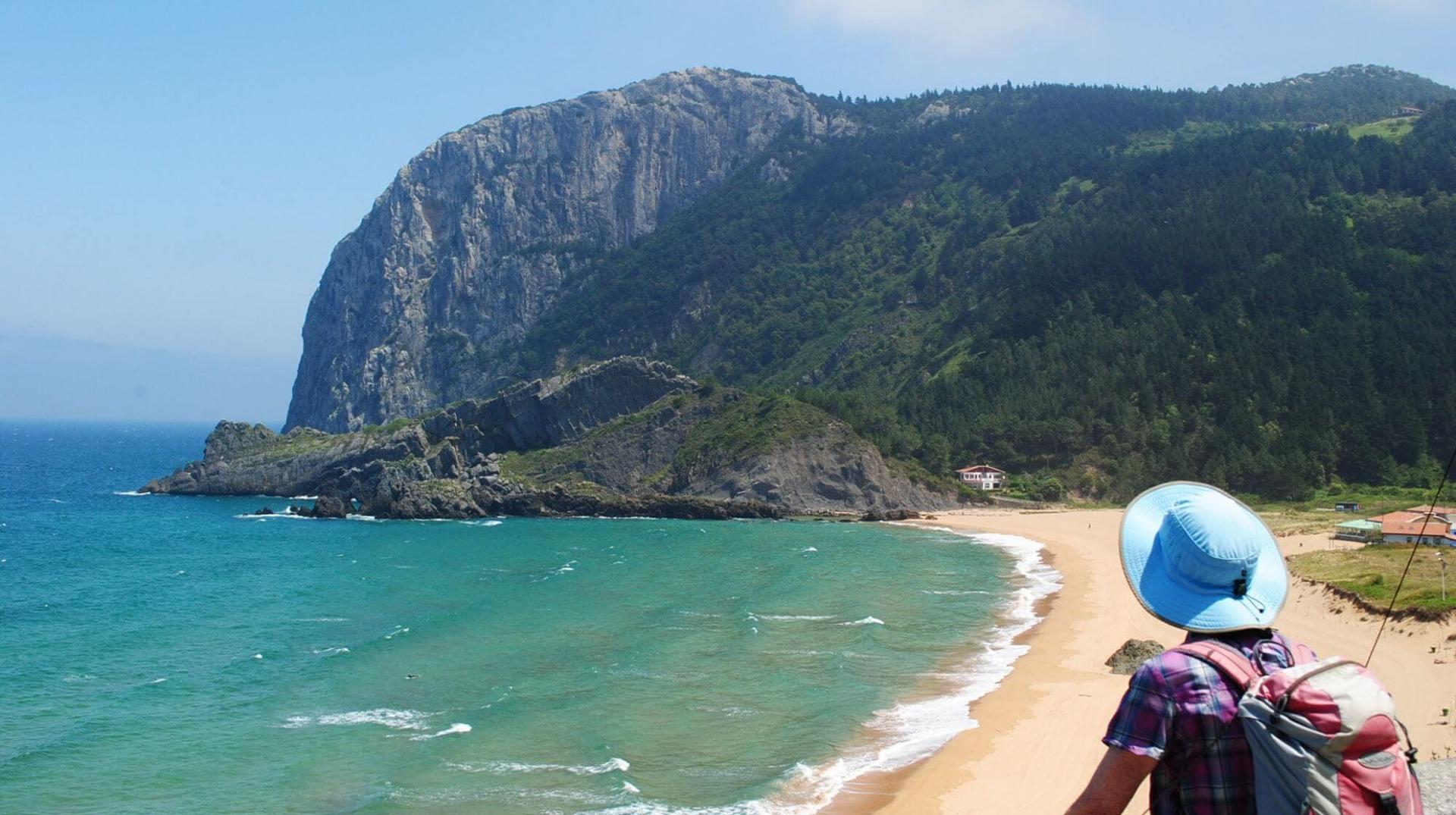 Walker overlooking Laga Beach and the dramatic Basque coastline on the way to Bilbao