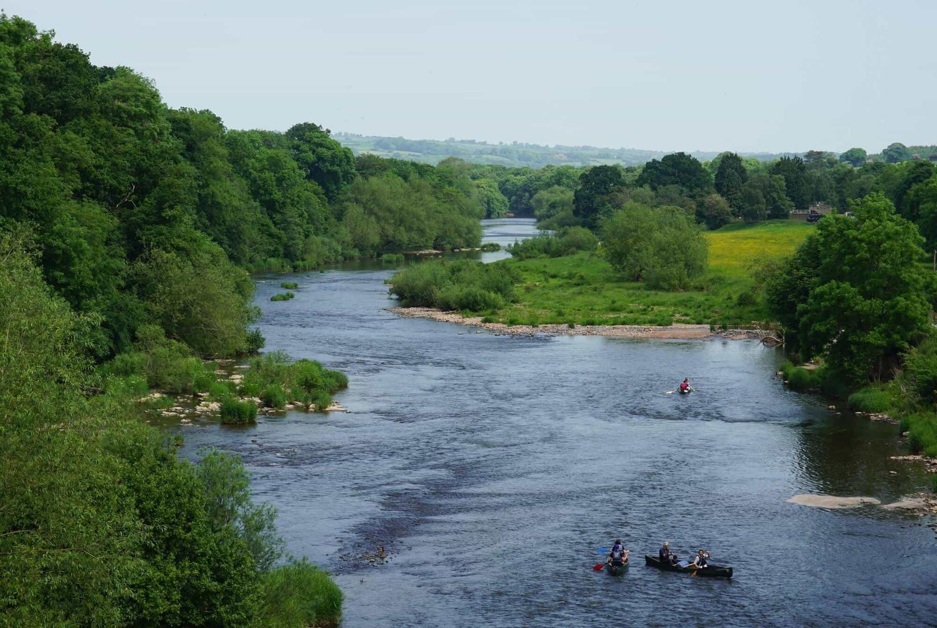 Canoes on the River Wye in the Wye Valley along the Offa’s Dyke Path walking holiday