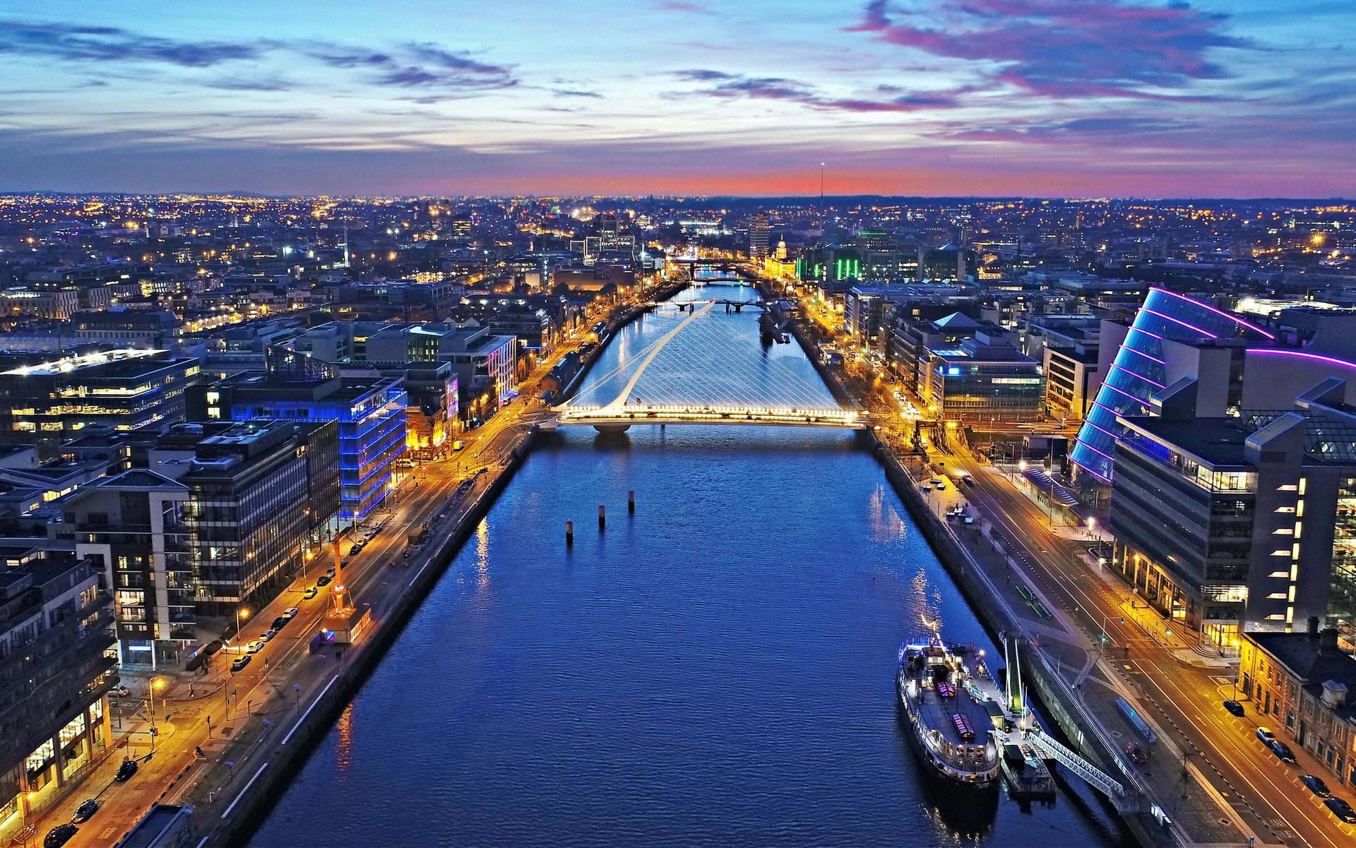 Evening skyline of Dublin city with River Liffey in foreground