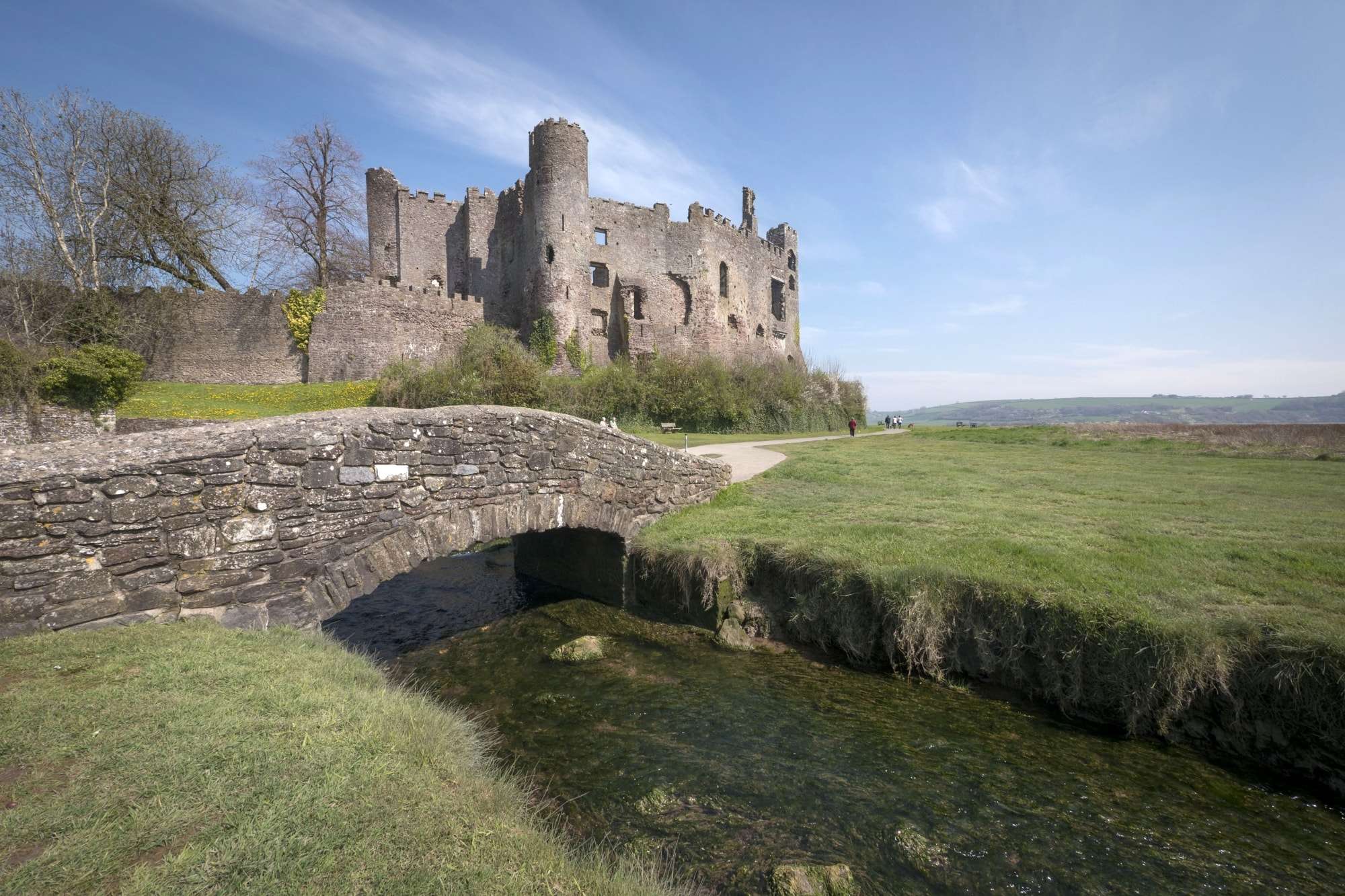 Image of Laugharne Castle, with small bridge over the Taf Estuary