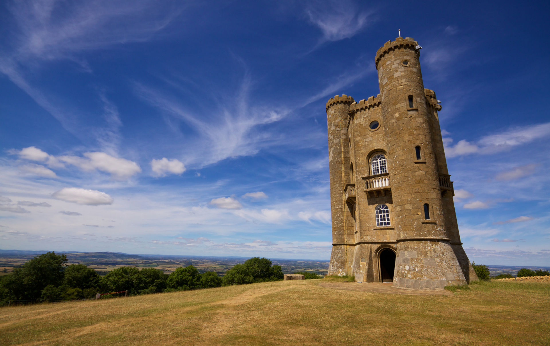 Broadway Tower on the Cotswold Way, with countryside beyond.