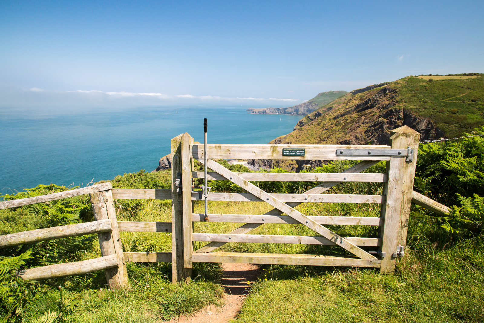 Gate overlooking Cardigan Bay on the coast at Mwnt