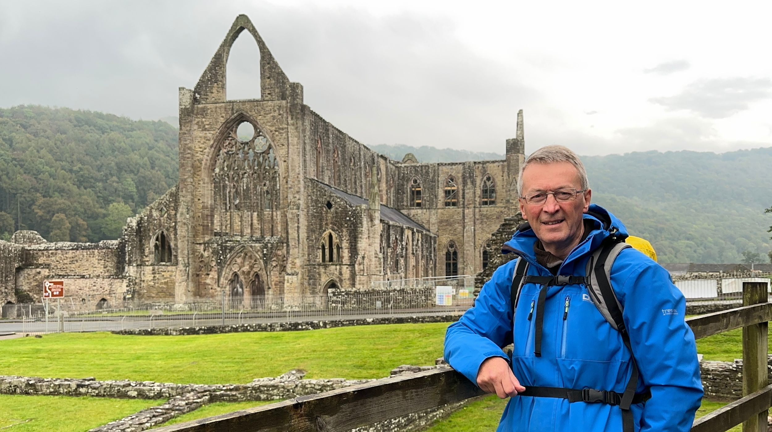 Walker at Tintern Abbey, Wales, on an overcast day