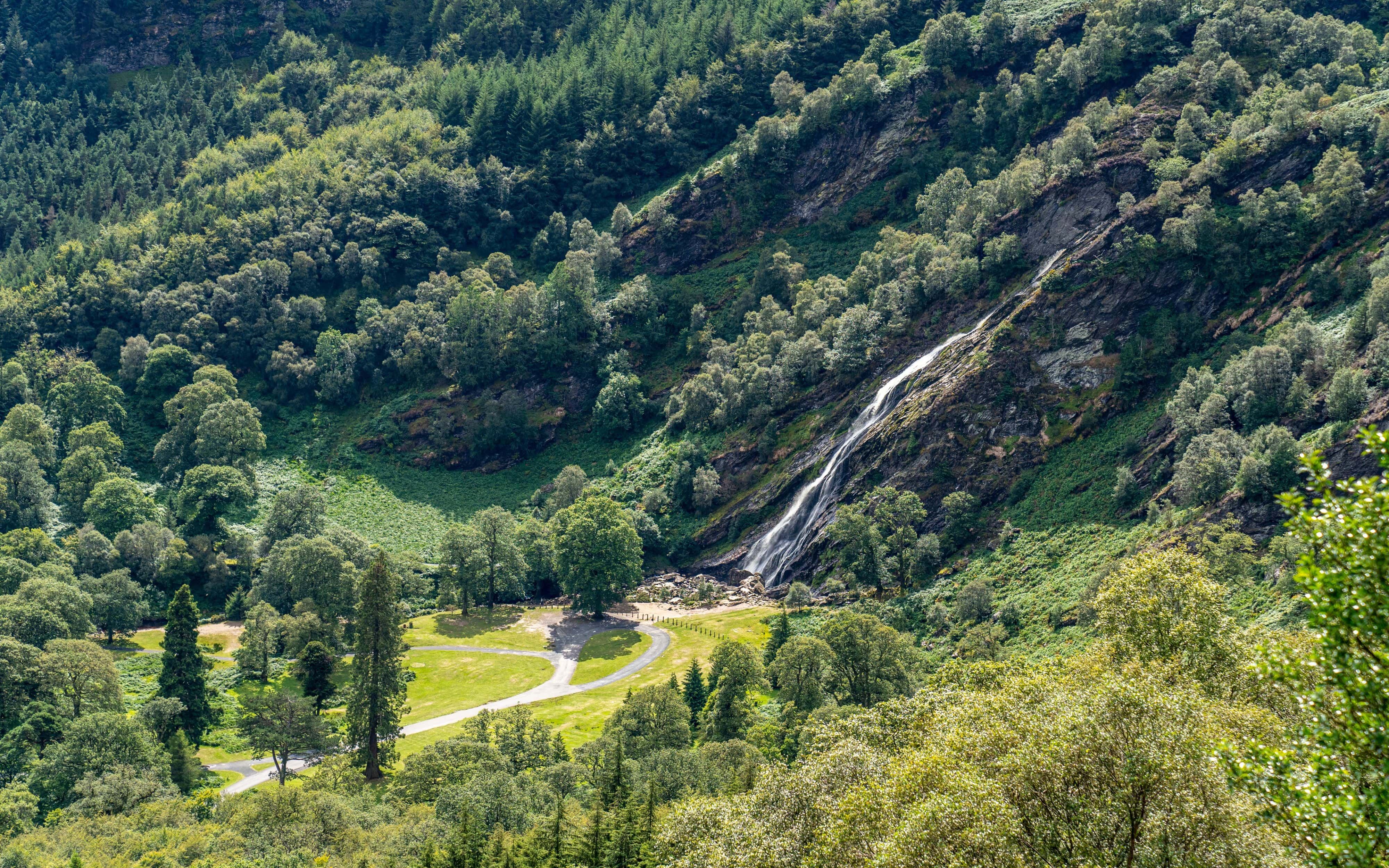 Powerscourt Waterfall cascading down a lush green mountainside in Wicklow