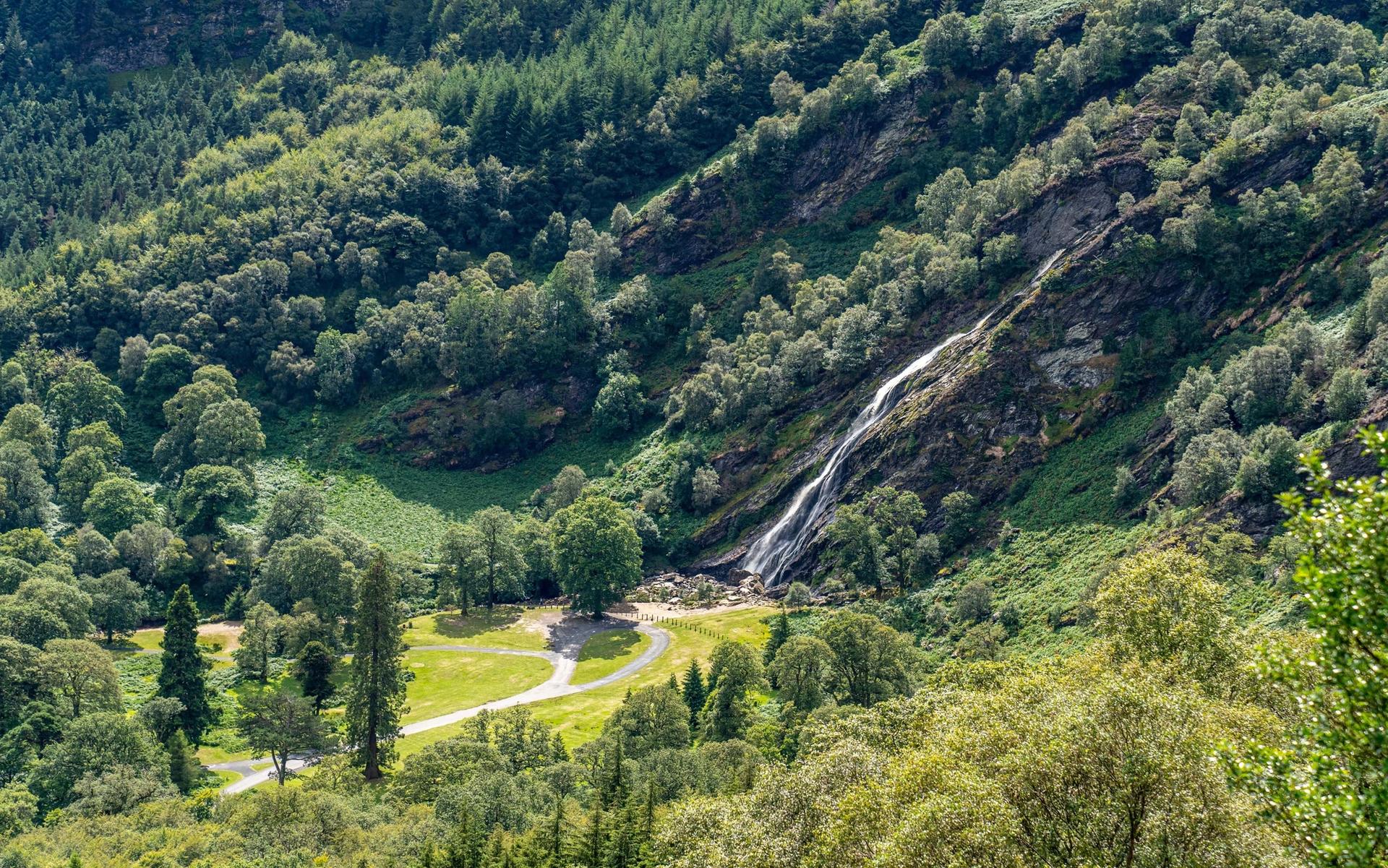 Powerscourt Waterfall cascading down a lush green mountainside in Wicklow