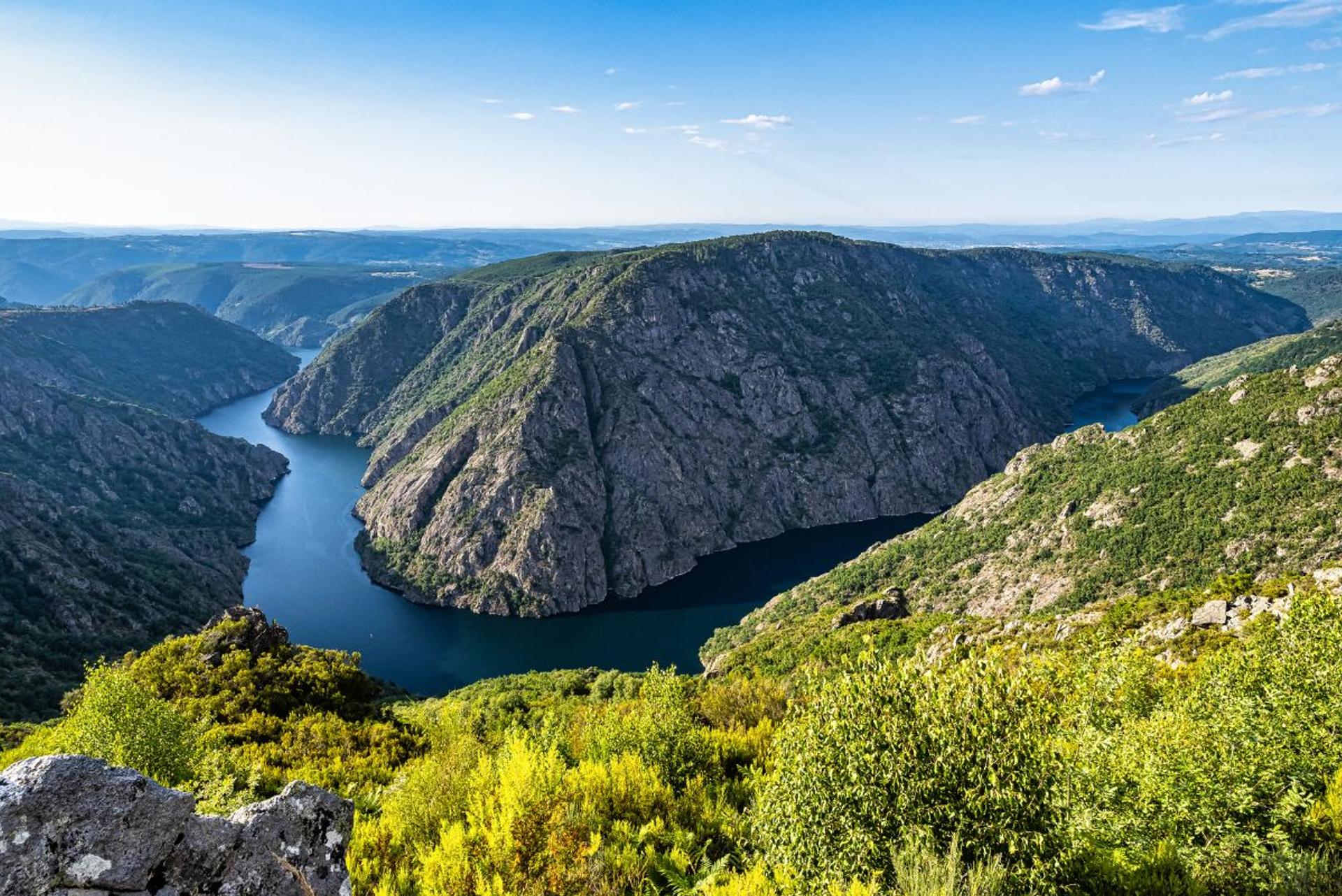 Ribeira Sacra canyon view over the Sil River with steep cliffs and winding water