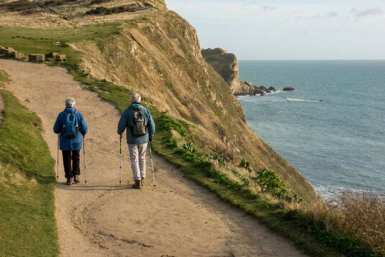 Walkers following a coastal path on a self-guided walking holiday.