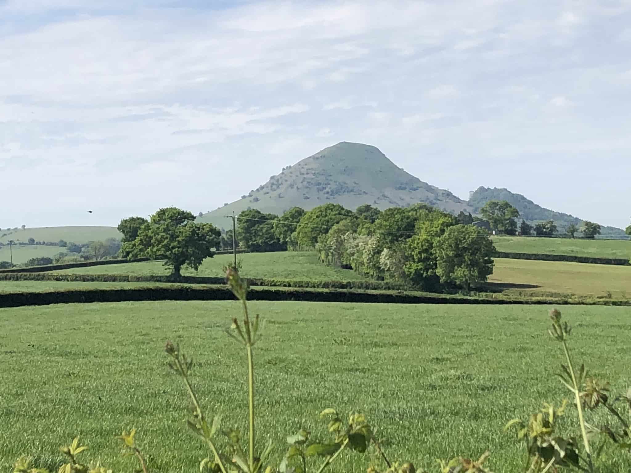 The Wrekin rising above farmland near Wellington in Shropshire on Offa’s Dyke Path