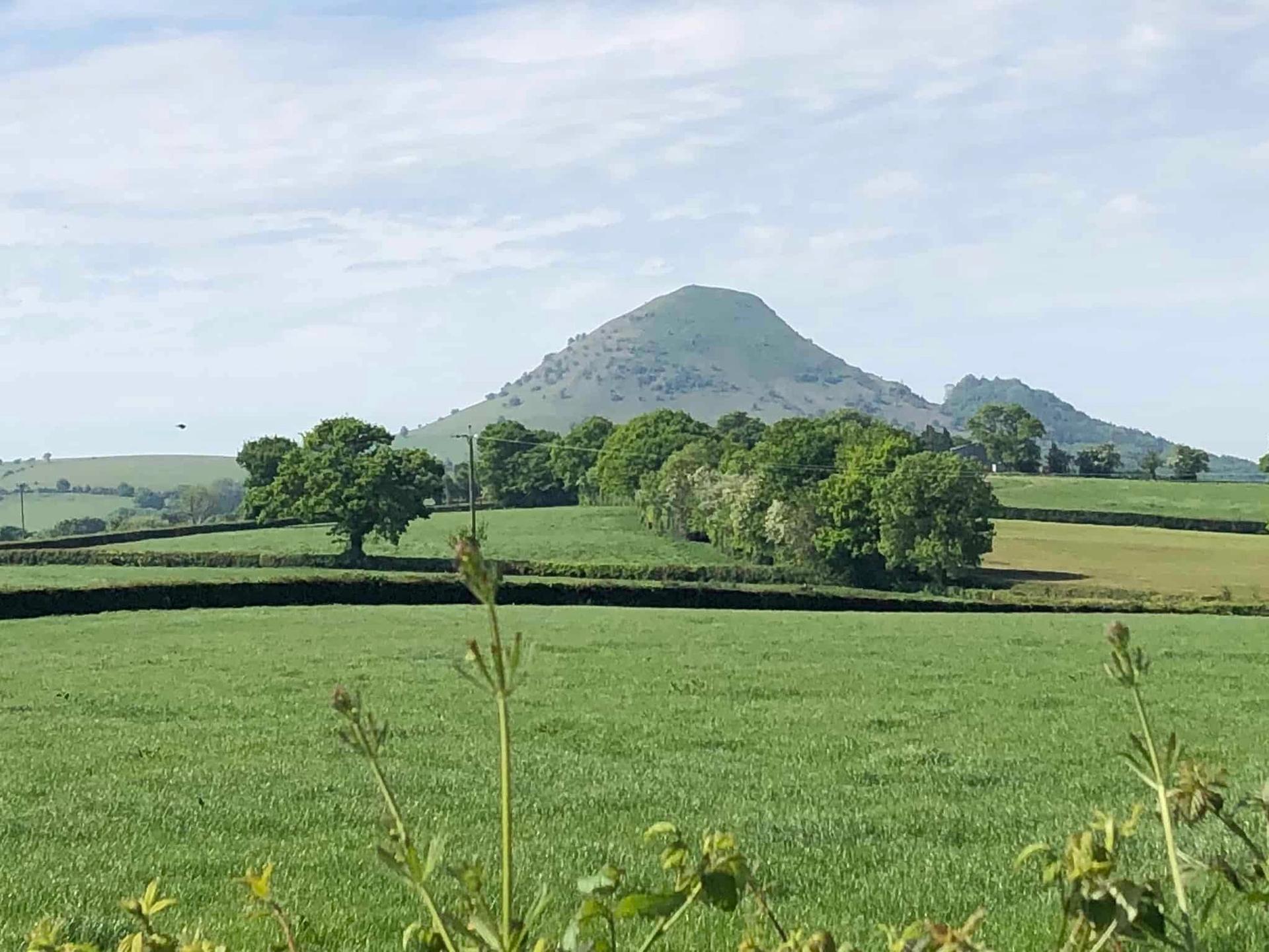 The Wrekin rising above farmland near Wellington in Shropshire on Offa’s Dyke Path