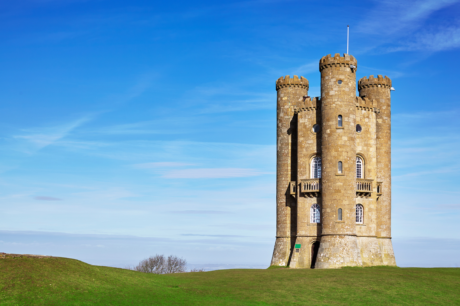 Broadway Tower standing on a grassy hilltop in the Cotswolds.