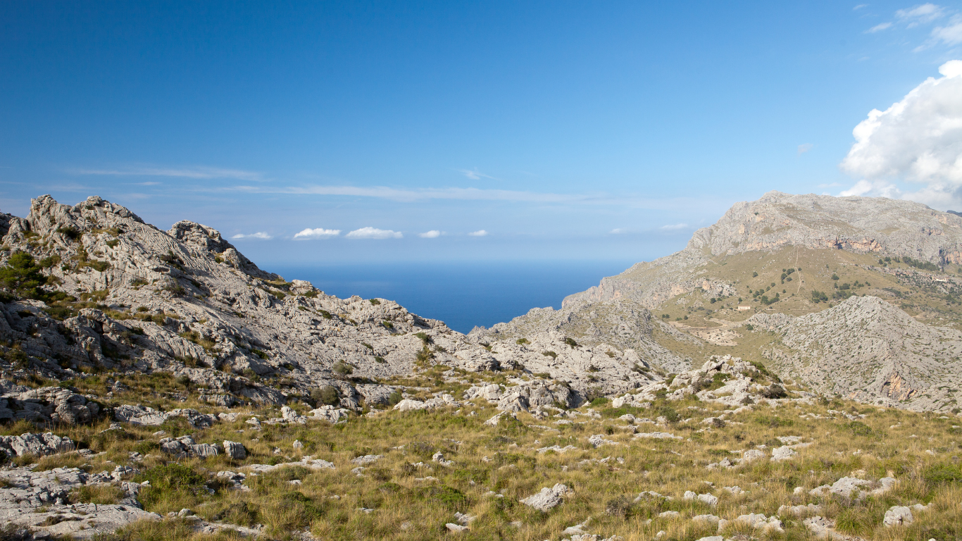 Rocky mountain path in the Serra de Tramuntana with the Mediterranean beyond