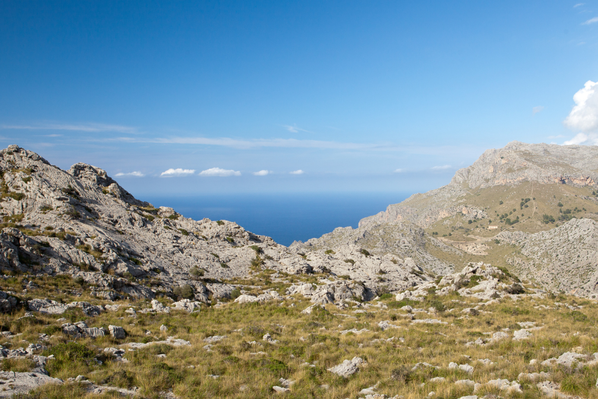 Rocky mountain path in the Serra de Tramuntana with the Mediterranean beyond