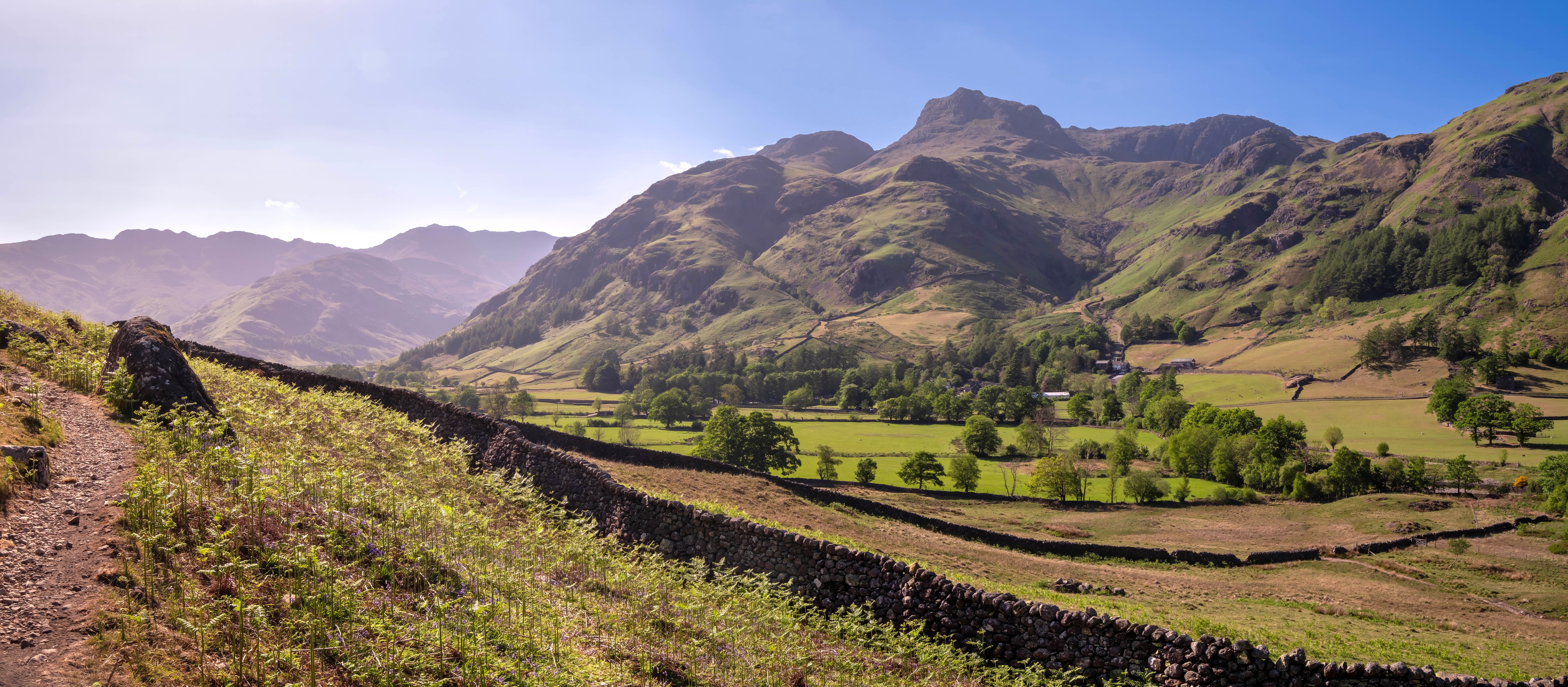 Great Langdale and the Langdale Pikes beside a dry-stone wall on the Cumbria Way