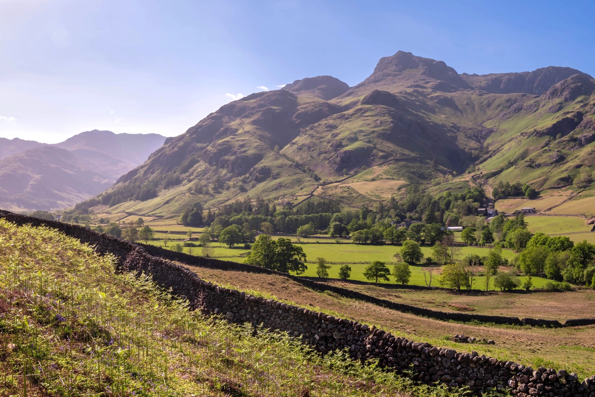 Great Langdale and the Langdale Pikes beside a dry-stone wall on the Cumbria Way