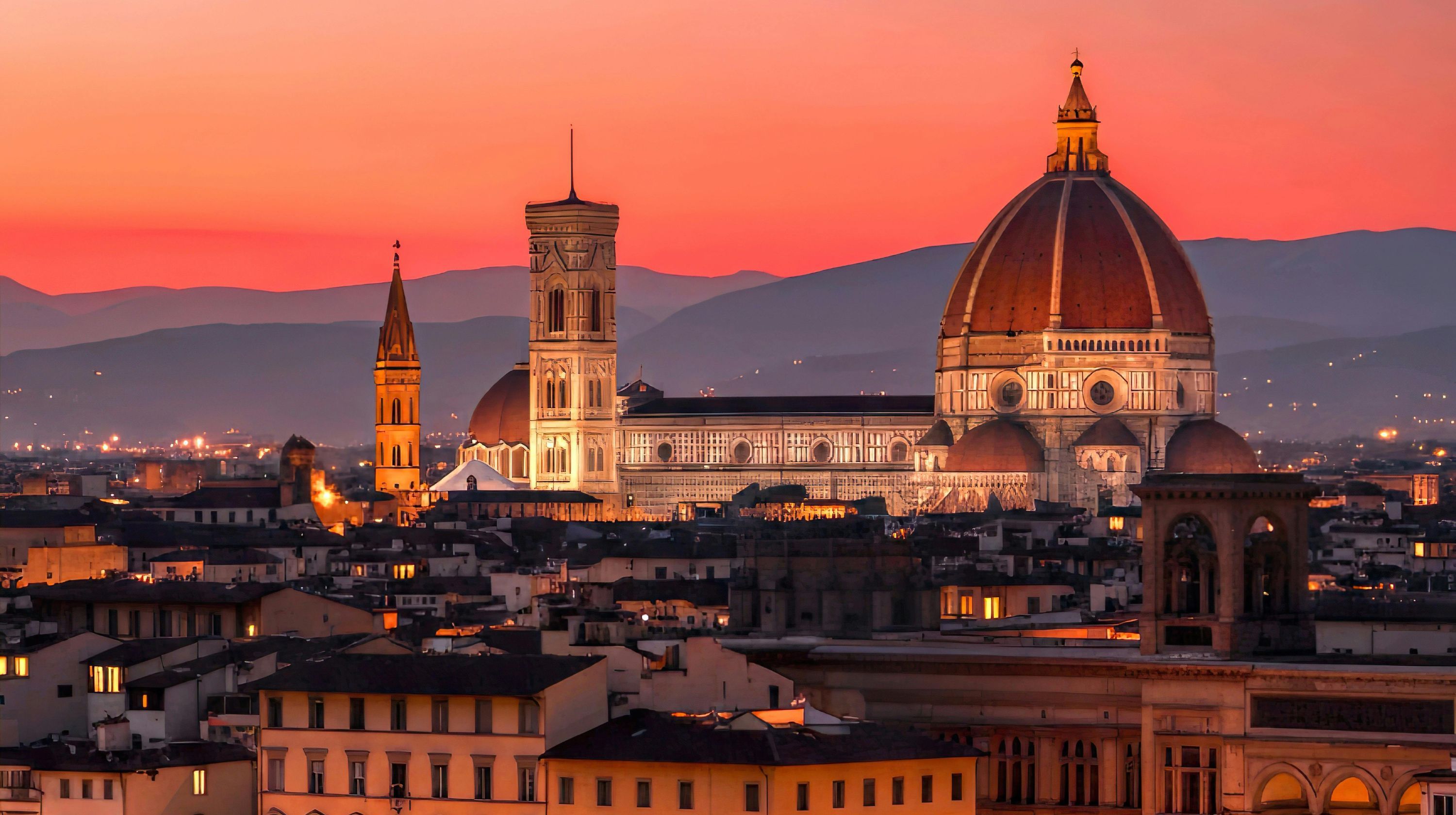The Florence Cathedral and Giotto's Campanile are illuminated against a vibrant sunset sky, with rolling hills in the background.
