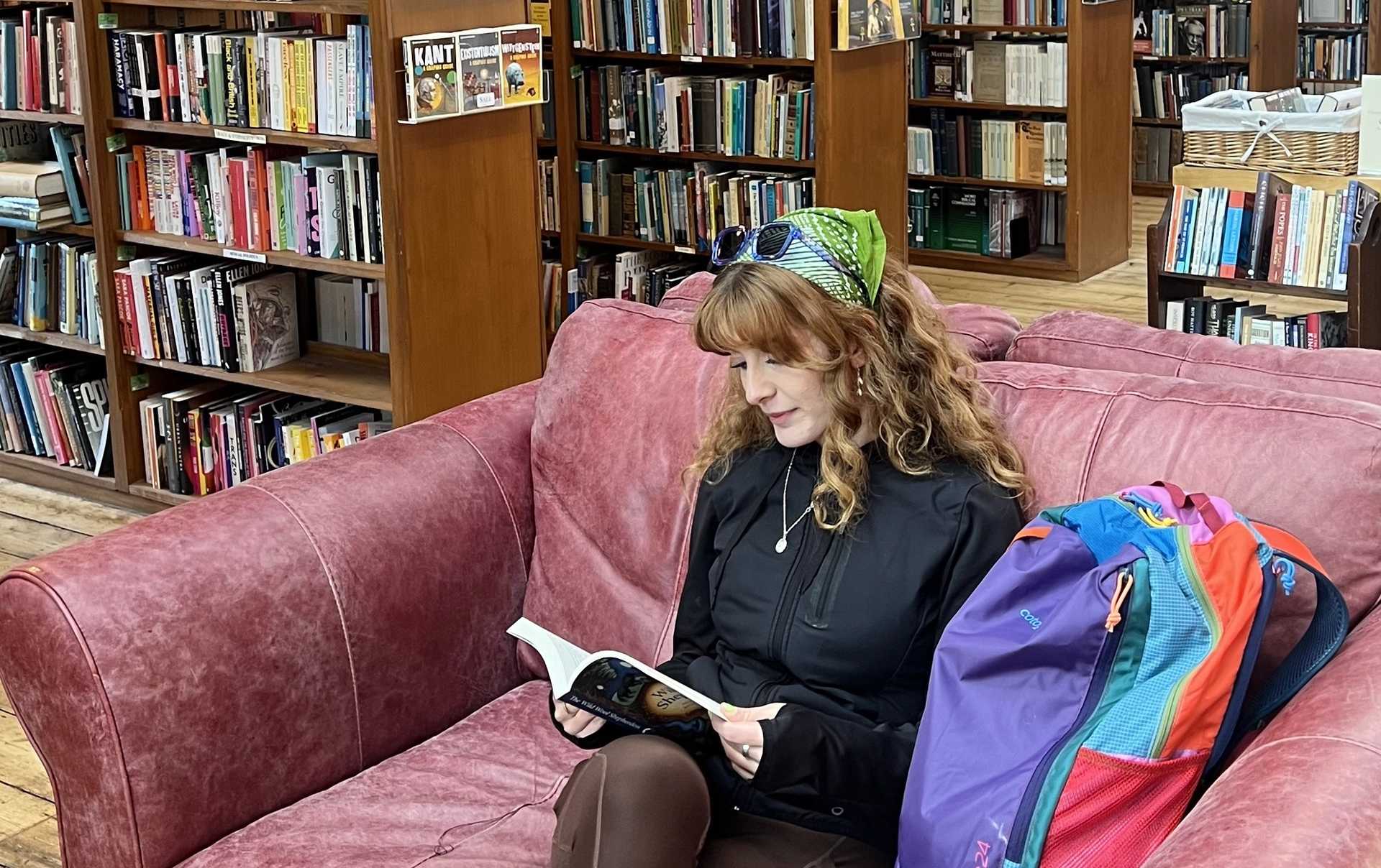 Walker browsing books at Hay-on-Wye's famous outdoor secondhand bookshop