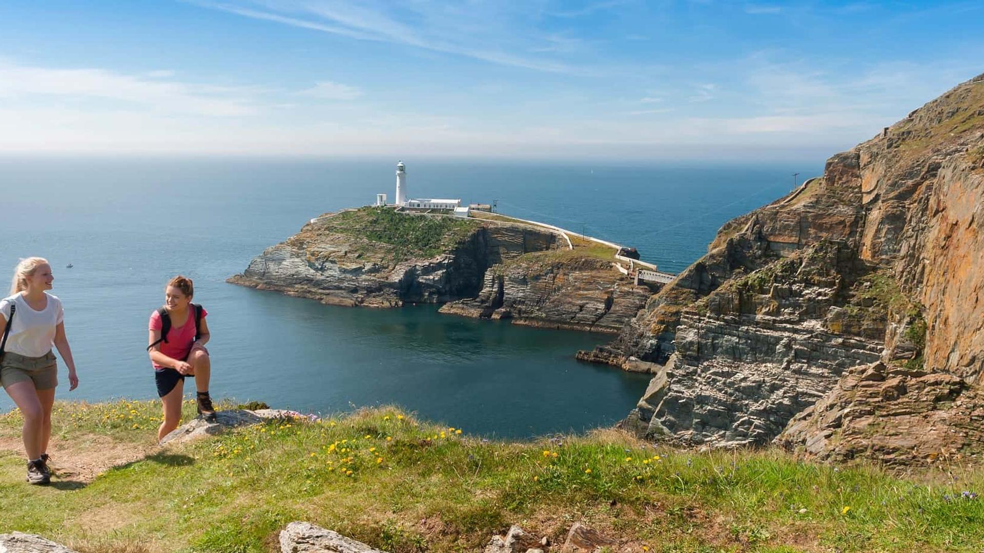 Smiling walkers on the Anglesey Coast Path