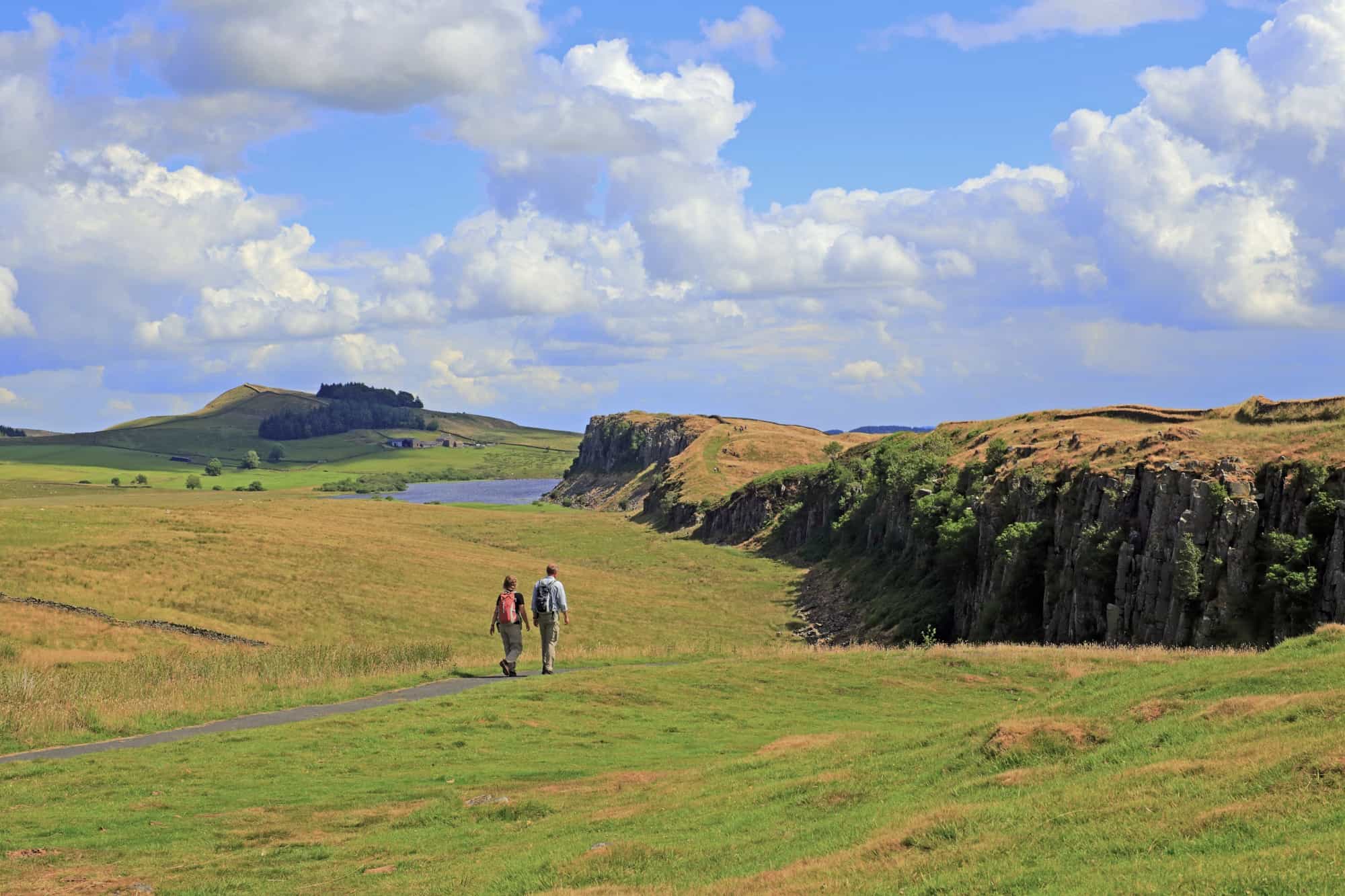 Walkers on Hadrian’s Wall Path near the Whin Sill and Crag Lough in Northumberland