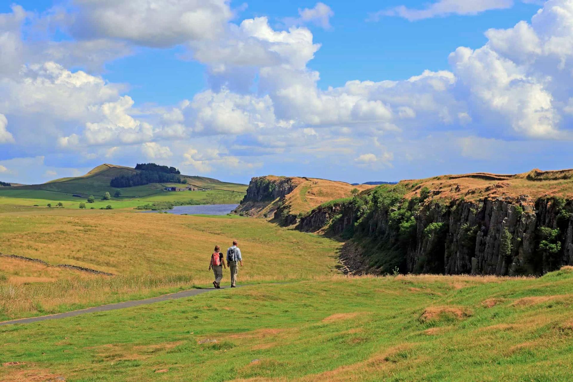 Walkers on Hadrian’s Wall Path near the Whin Sill and Crag Lough in Northumberland