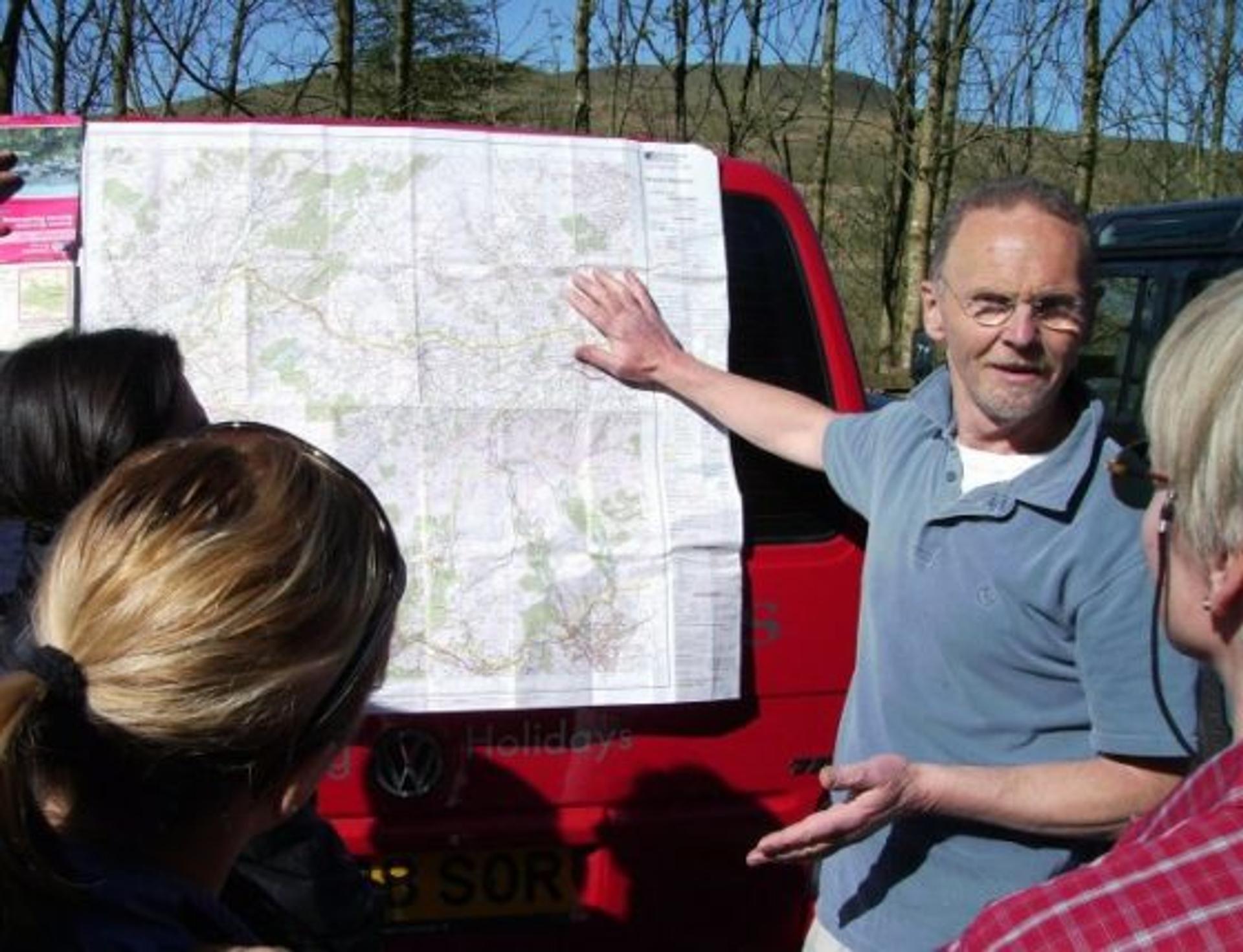 Angus explaining a walking route to a group