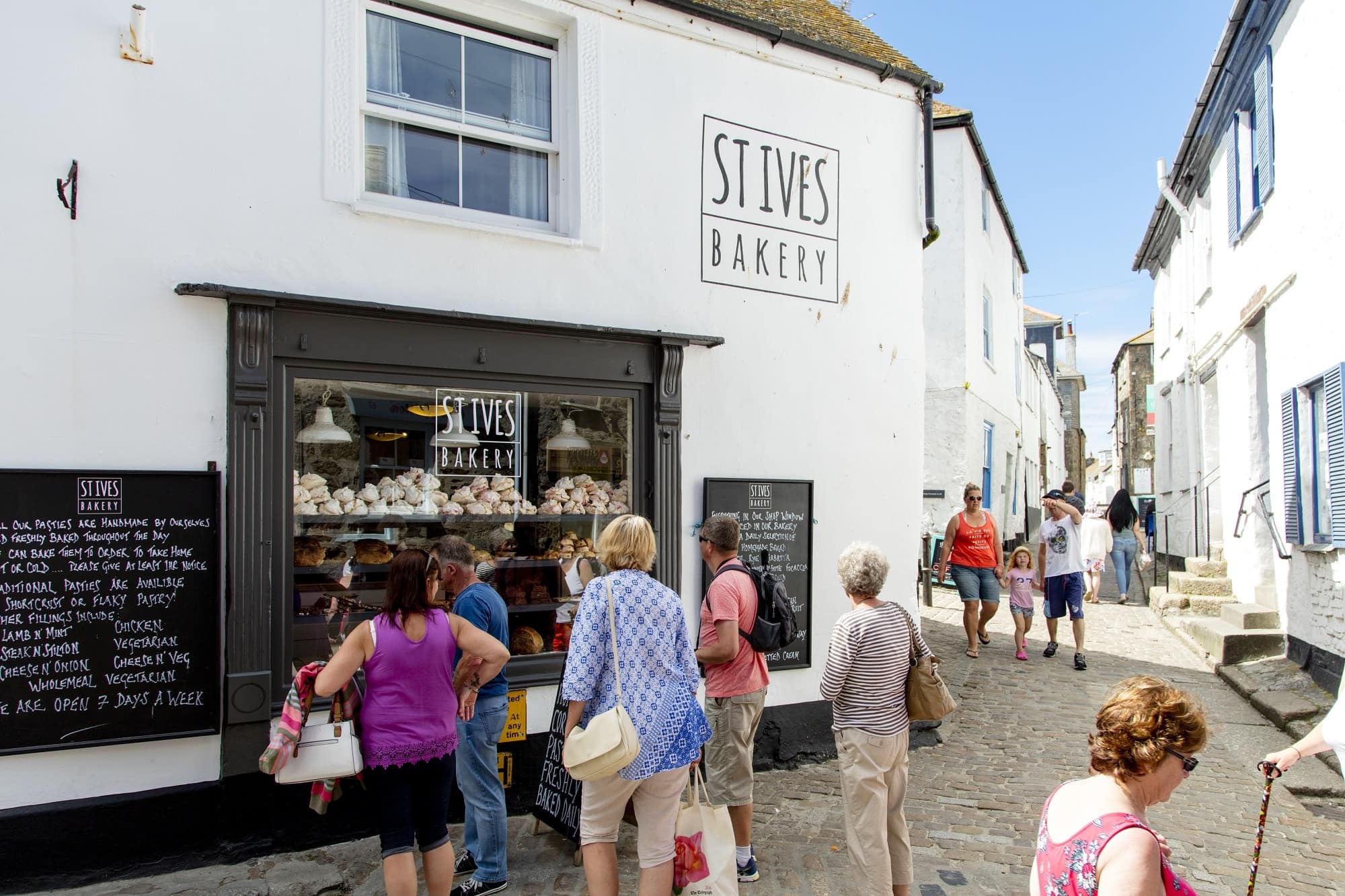 image of small group inspecting the pastries at St.Ives Bakery