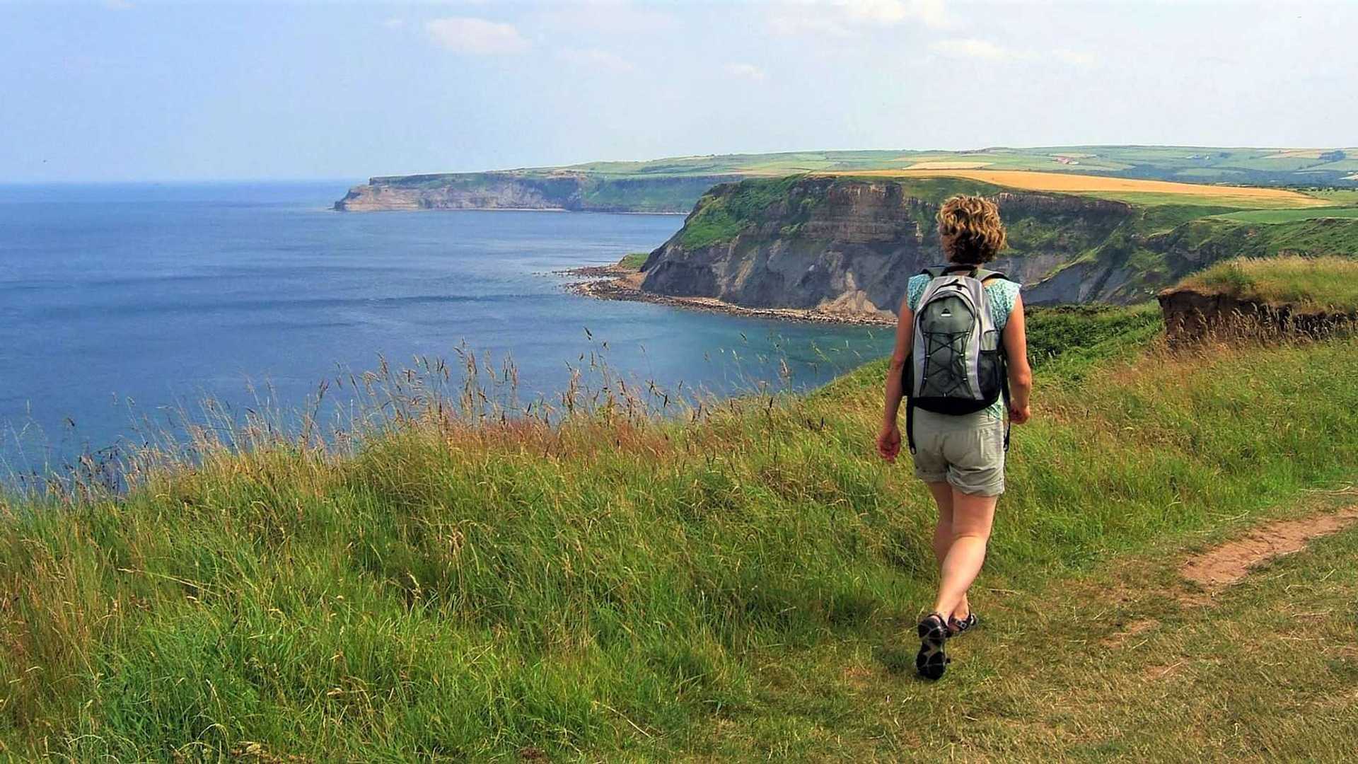 Hiker admiring the views out over the cliffs