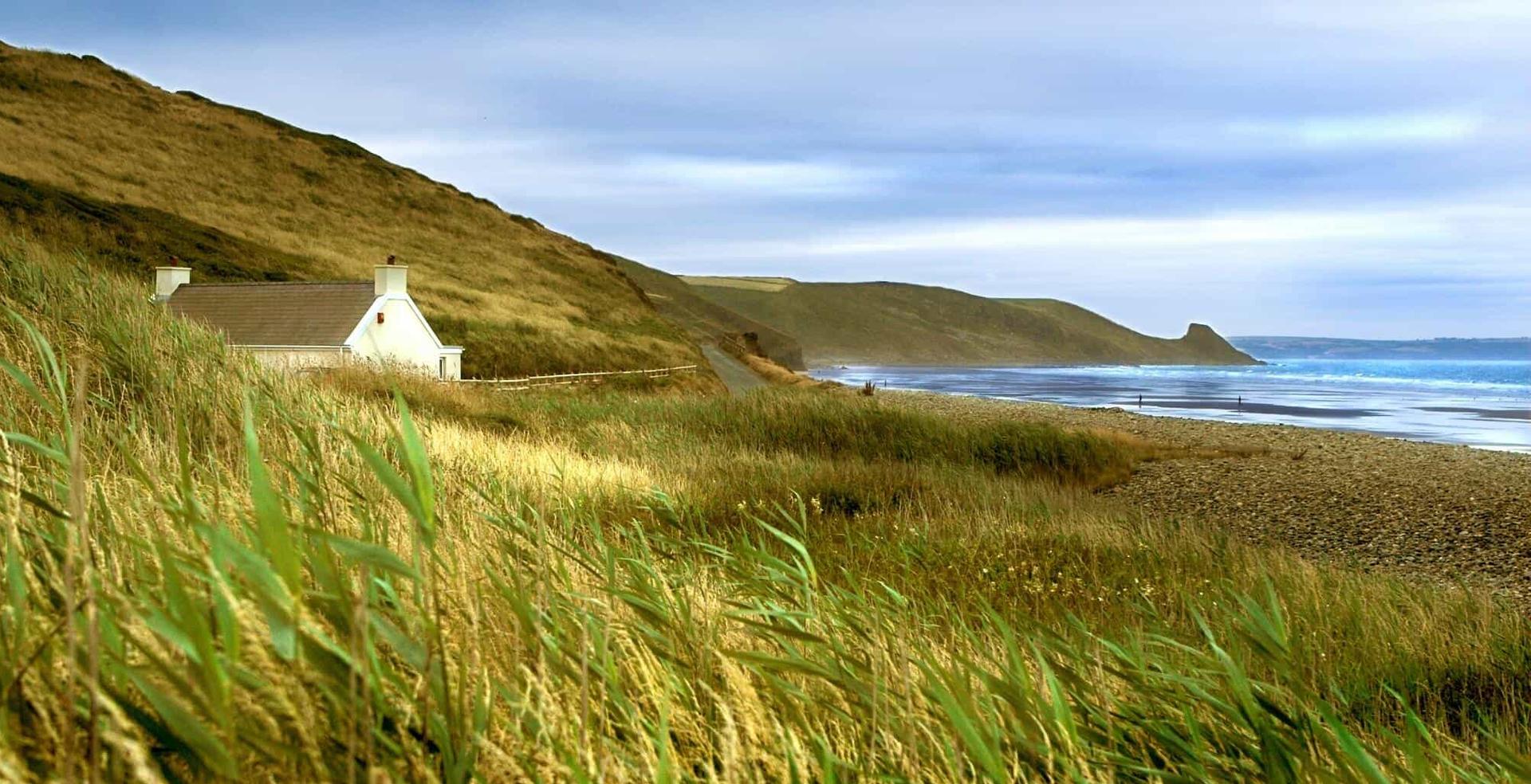 Pembrokeshire coast path view, beach-side house and beach