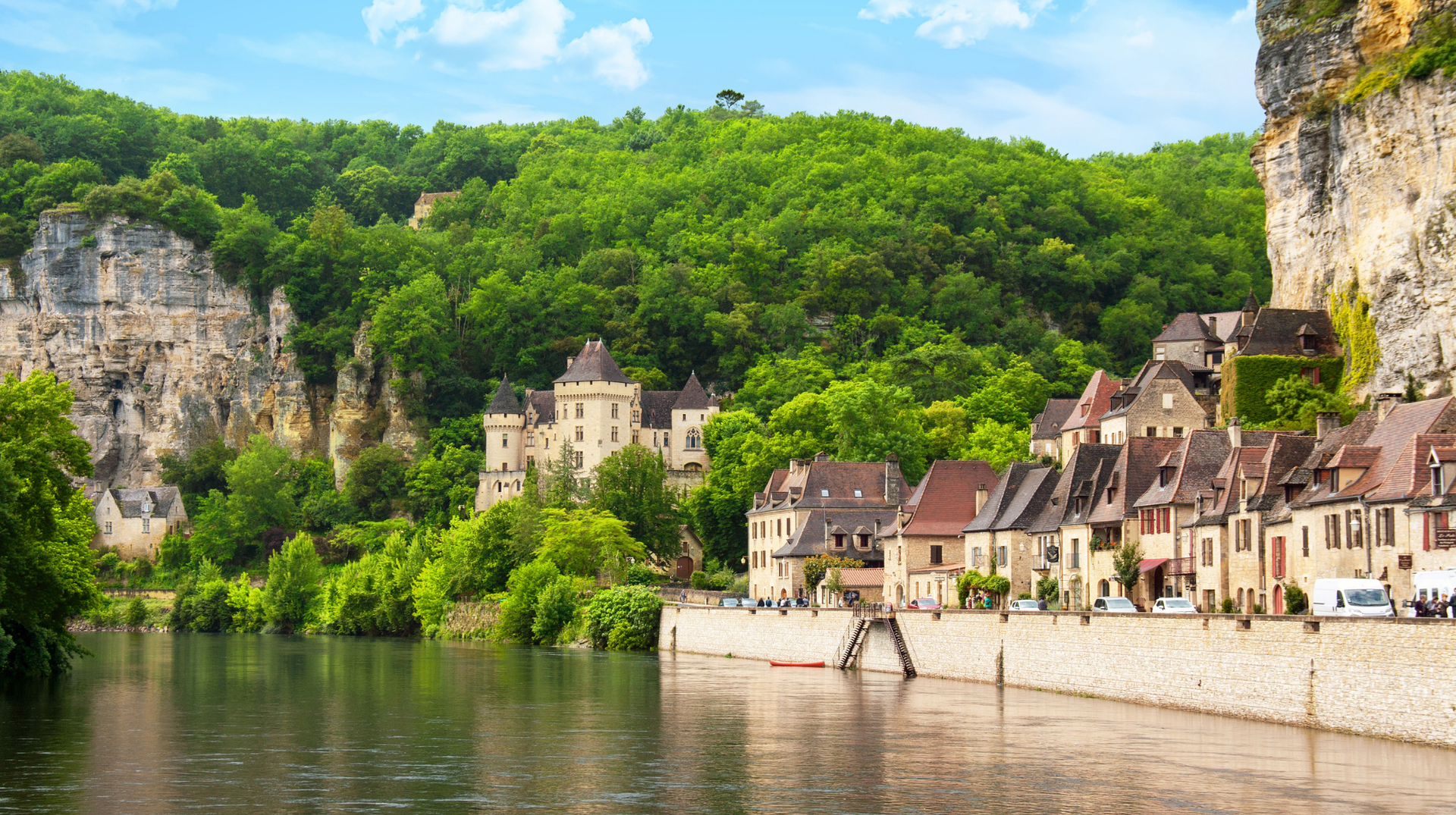 La Roque-Gageac on the Dordogne River, with limestone cliffs, old stone houses and wooded hills