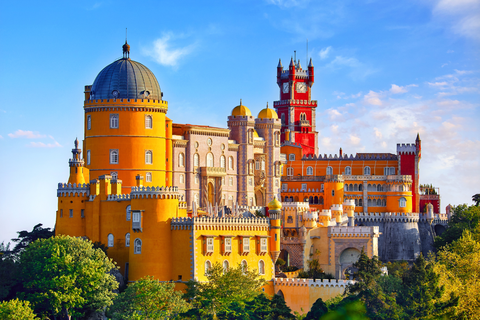Colourful yellow and red façades of Pena Palace in Sintra, Portugal.