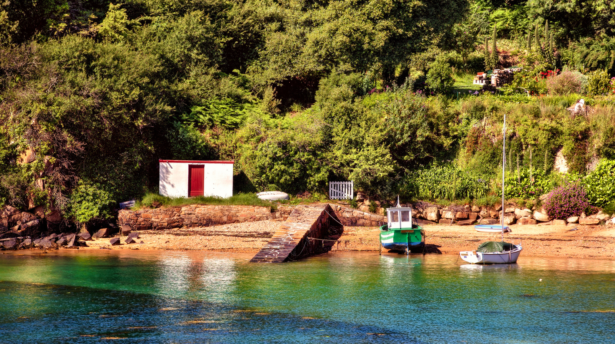 Small boats moored in a sheltered inlet on Bréhat Island