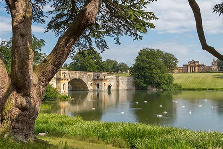River thames with Blenheim Palace over the bridge