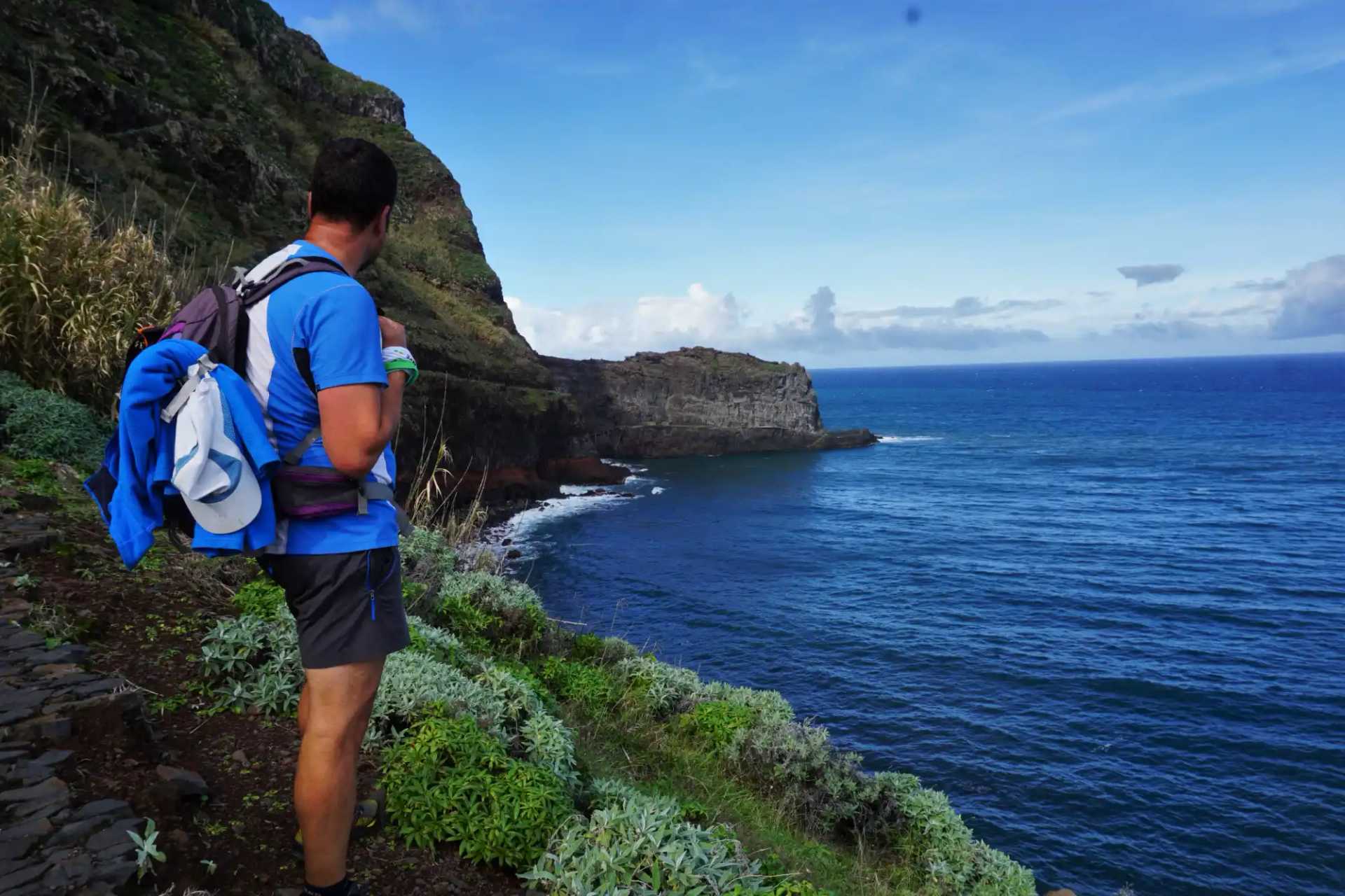 Walker on Madeira's rugged Atlantic coastline