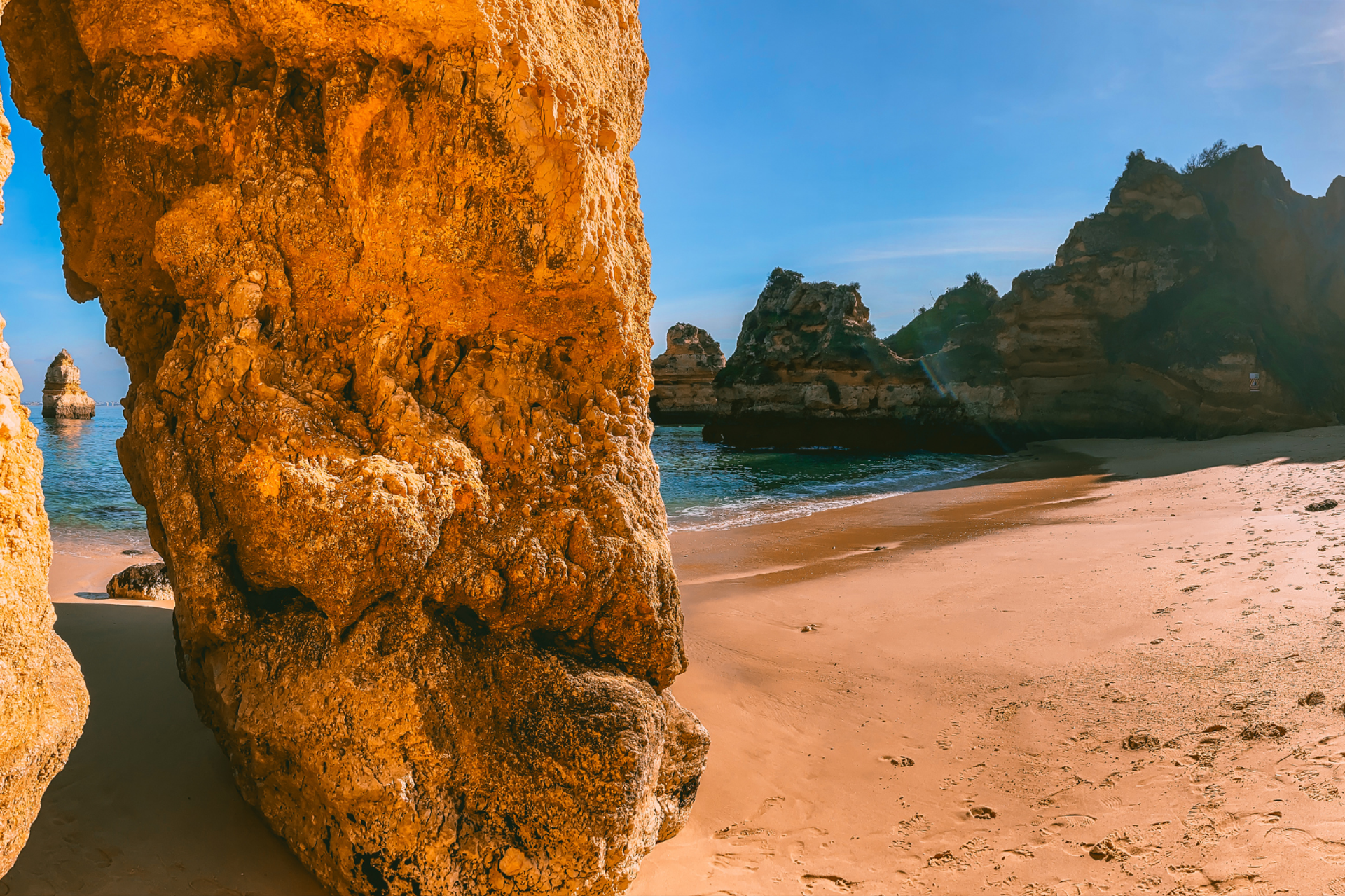 Sandy Praia do Guincho beach, with rocky cliffs and dunes near Cascais, Portugal.