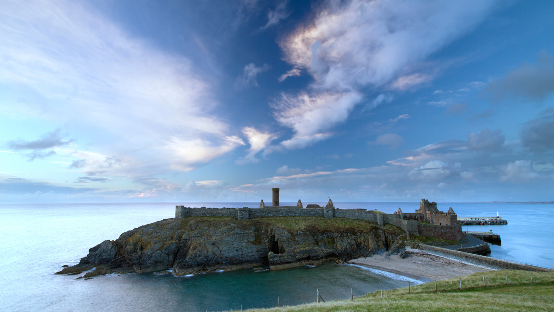 Peel Castle on St Patrick’s Isle, surrounded by sea on the Isle of Man coast.