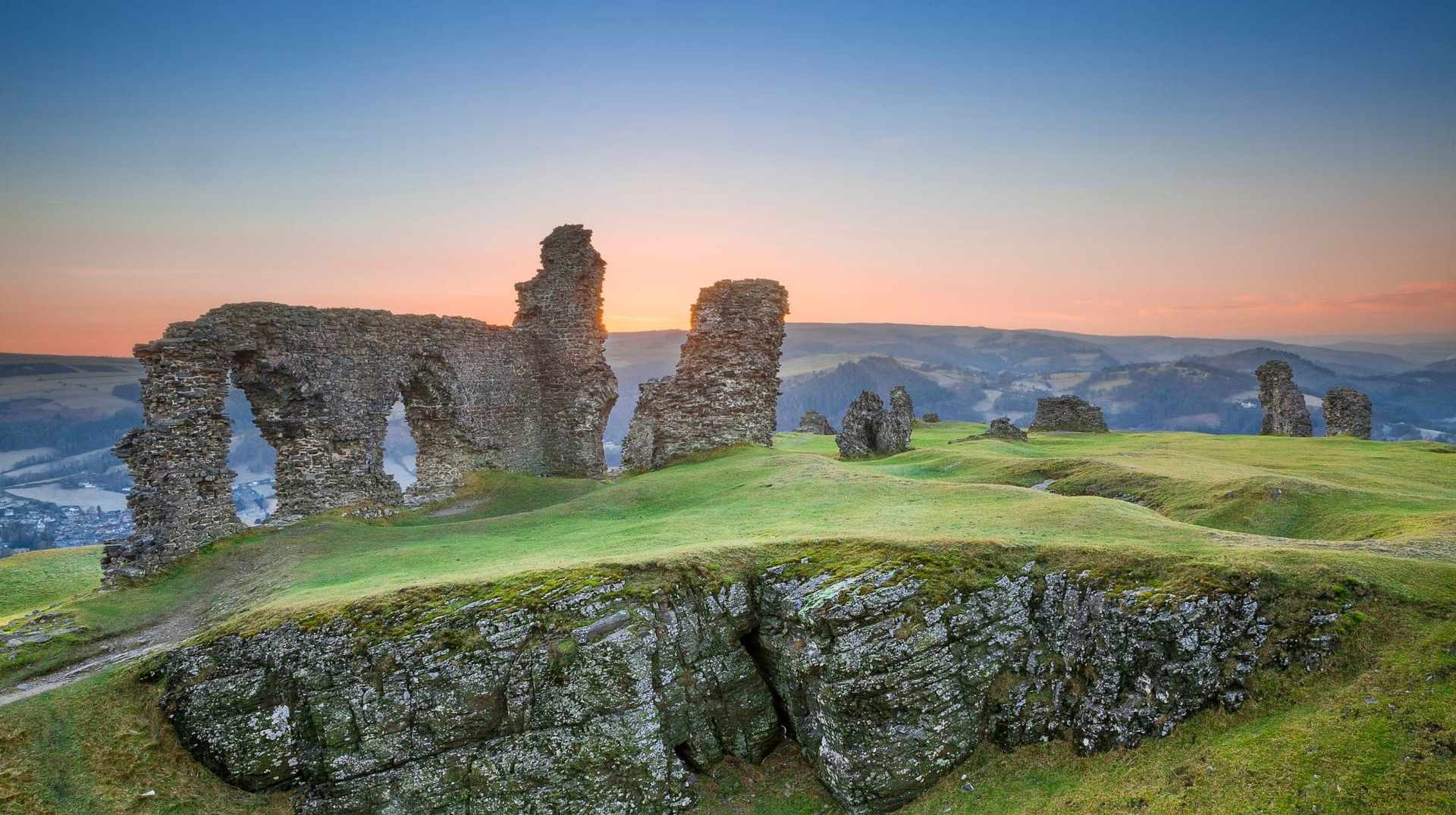 Dinas Bran castle ruins at sunset above Llangollen on the Offa’s Dyke Path walking holiday