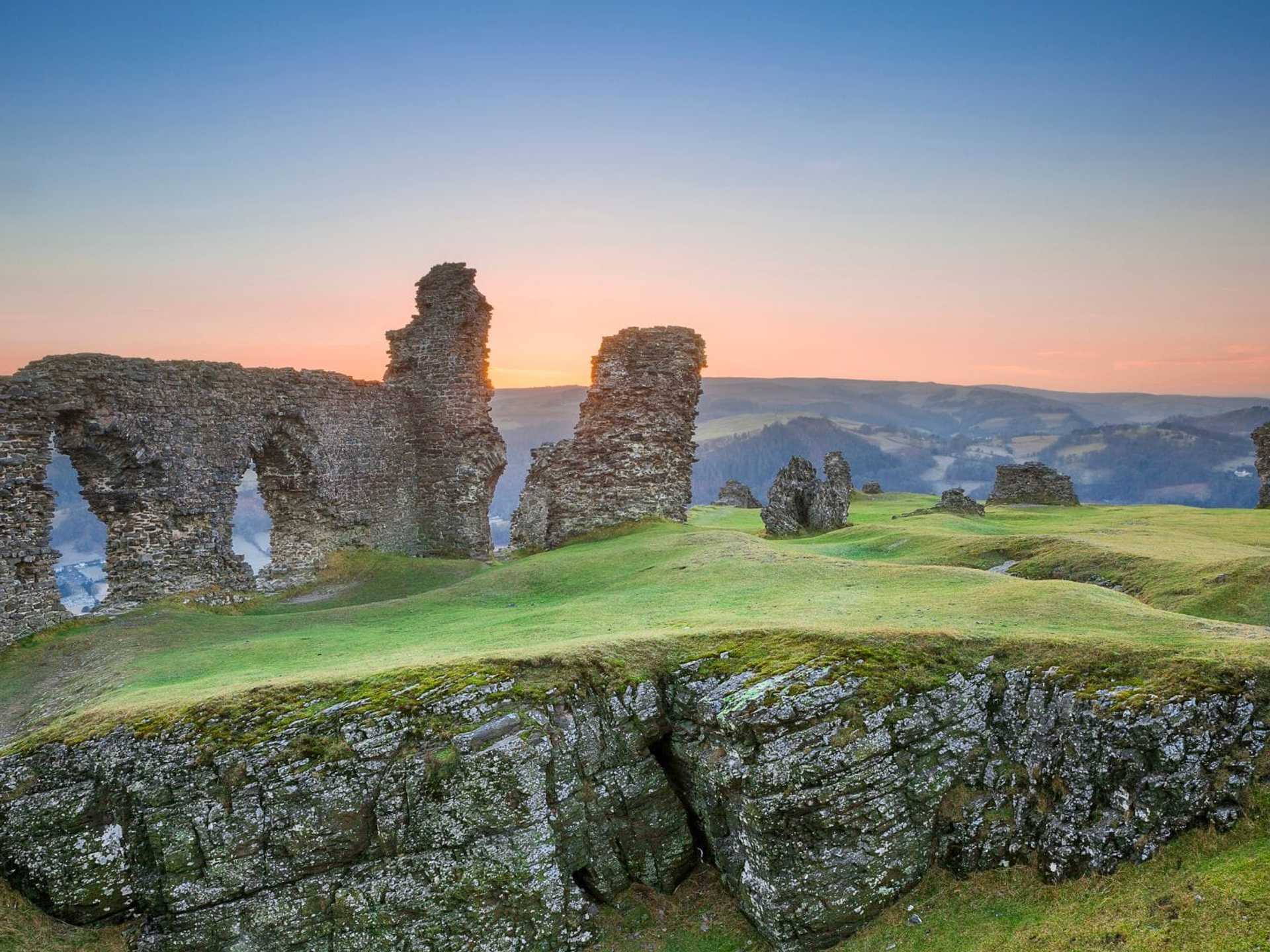 Dinas Bran castle ruins at sunset above Llangollen on the Offa’s Dyke Path walking holiday