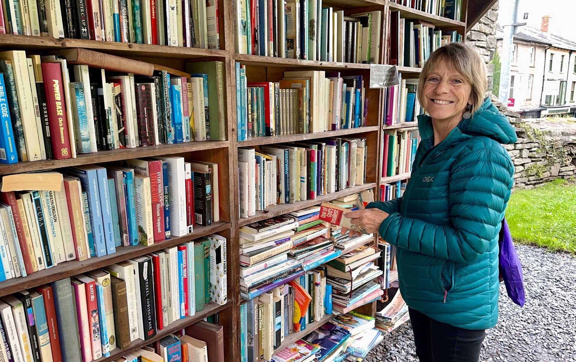 Walker browsing books at Hay-on-Wye's famous outdoor secondhand bookshop