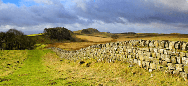 Hadrian’s Wall stretching across open moorland in Northumberland countryside