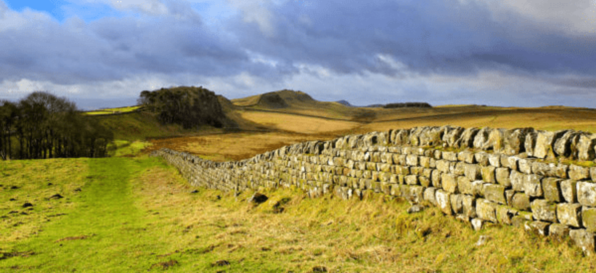 Hadrian’s Wall stretching across open moorland in Northumberland countryside