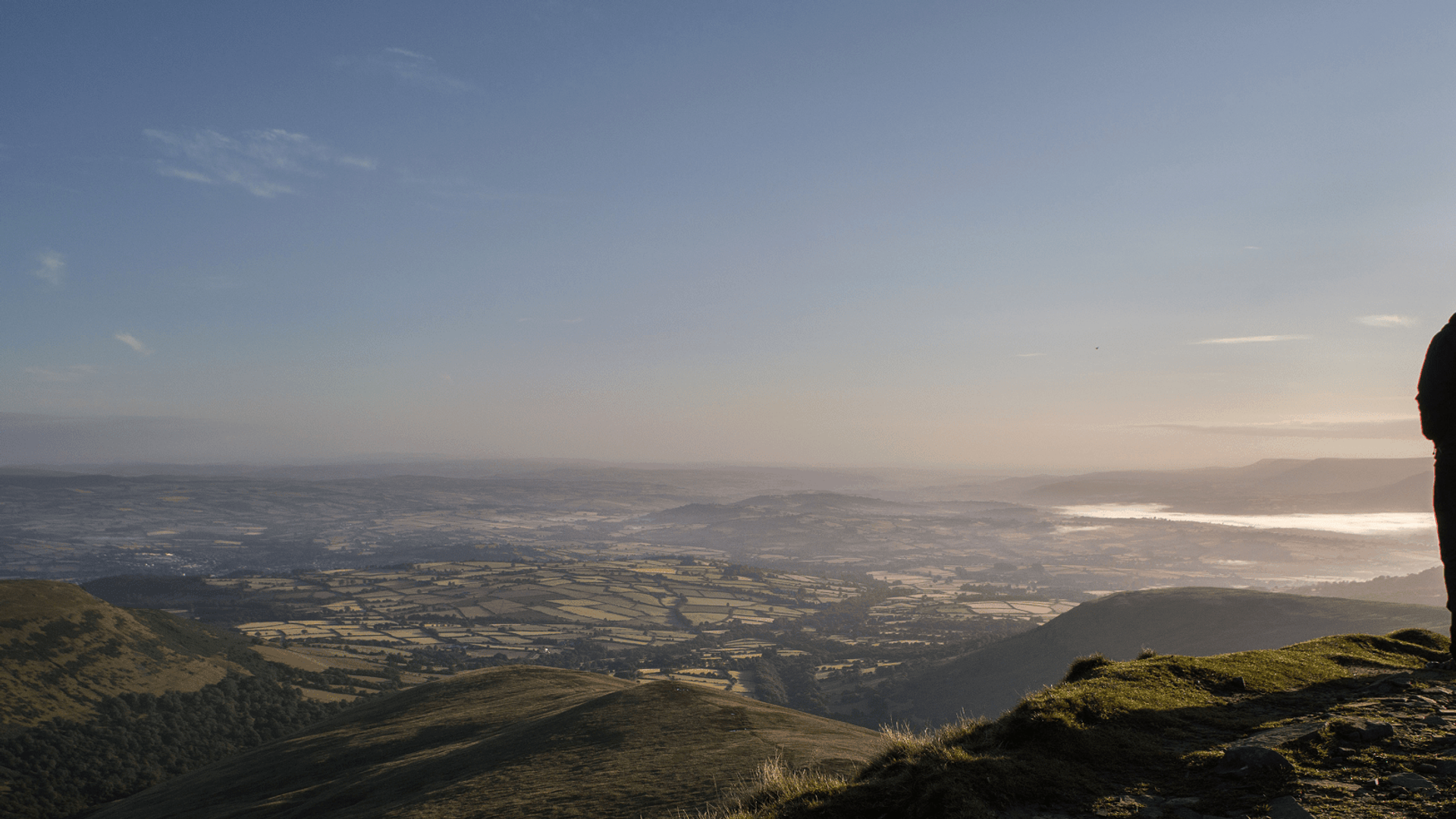 Walker staring out over Brecon Beacons