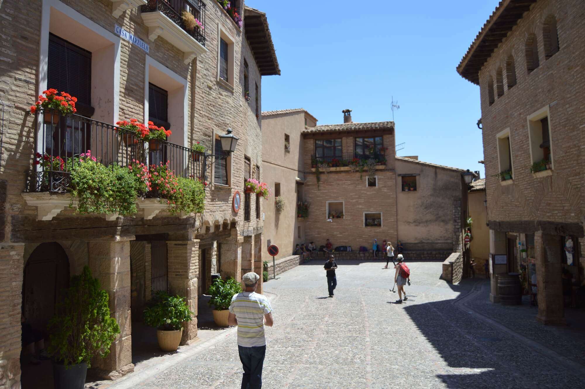 Cobbled square and stone houses in the medieval village of Alquézar, Aragon, Spain