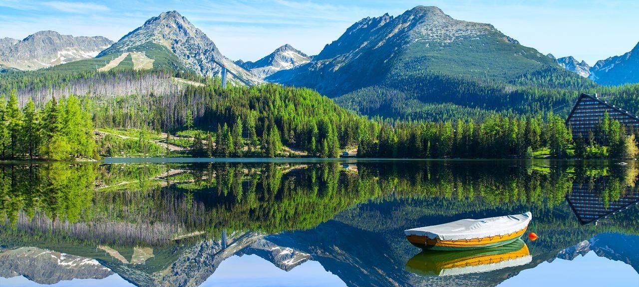 Walking path along a mountain lake near Štrbské Pleso in the High Tatras, Slovakia