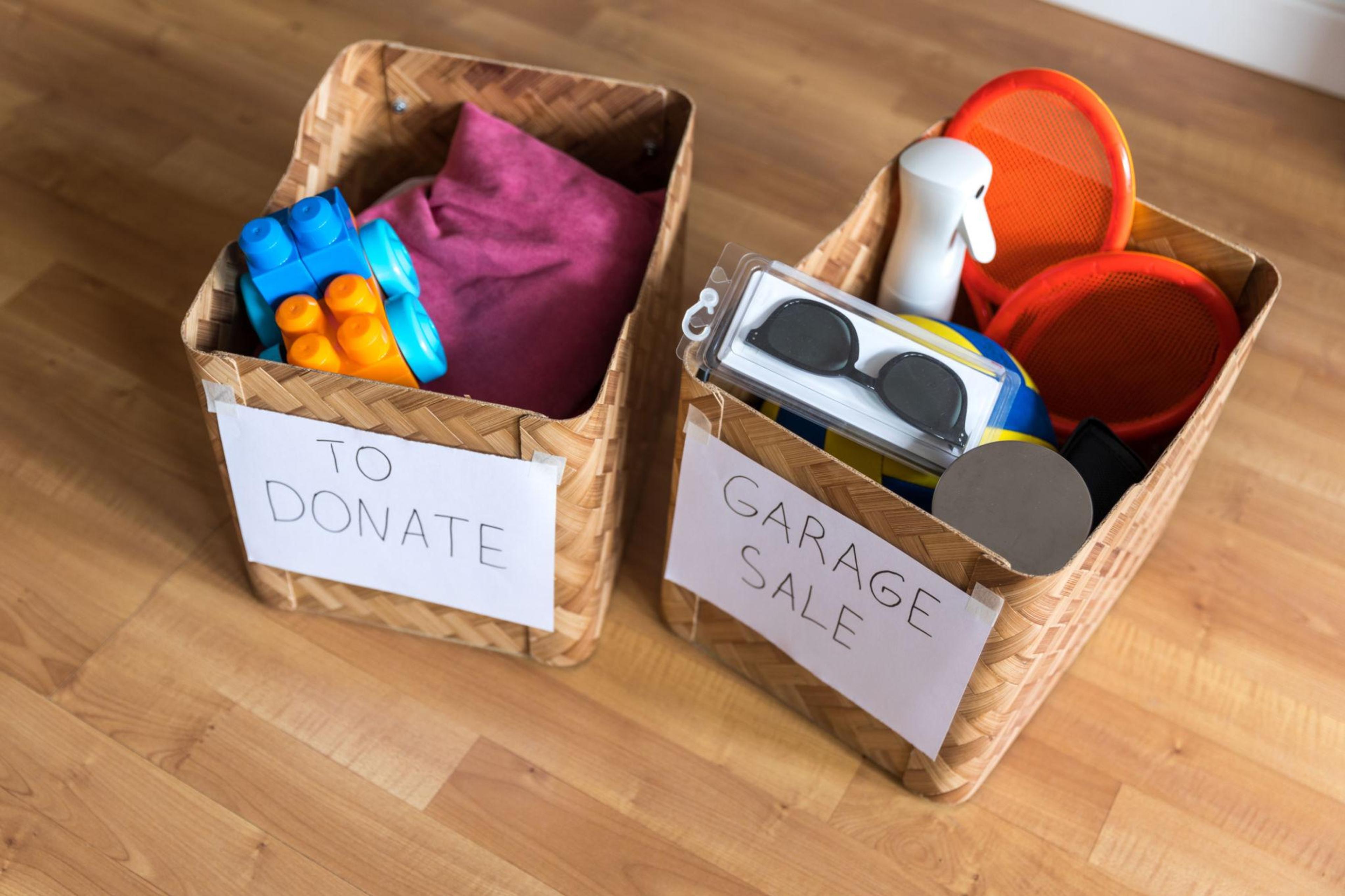 Boxes of things for a garage sale and donation. Decluttering, cleaning and moderate consumption for a sustainable life