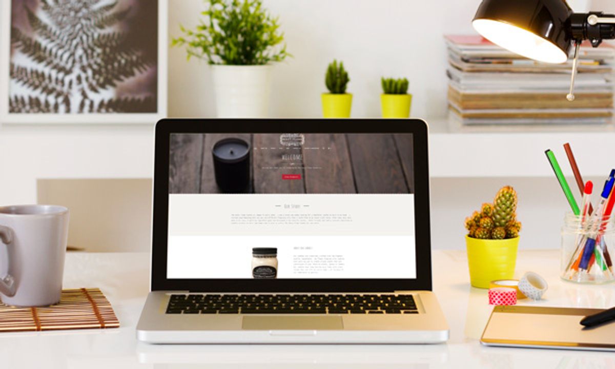 Candle shop home page on laptop