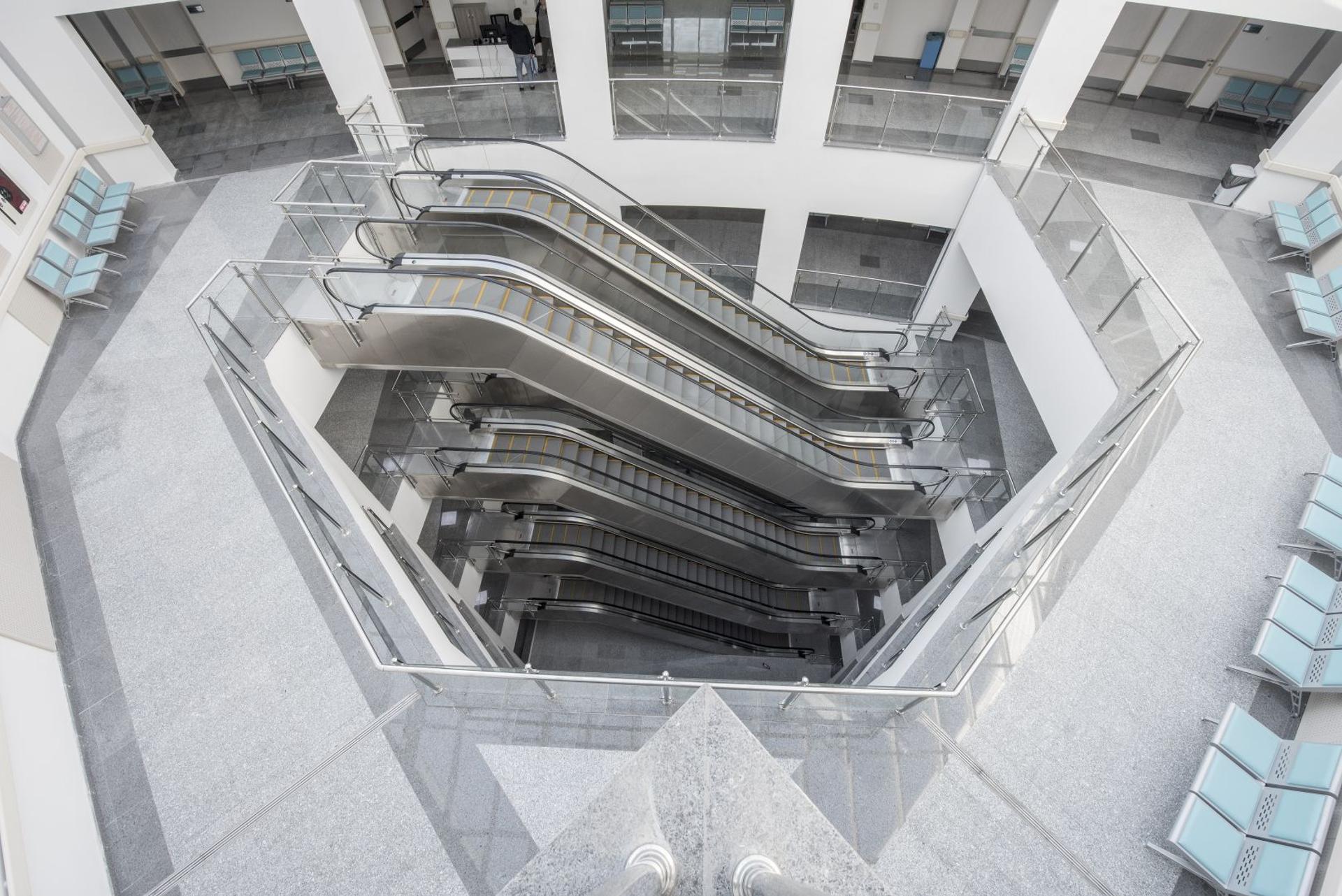 Escalators connecting floors in a healthcare building atrium