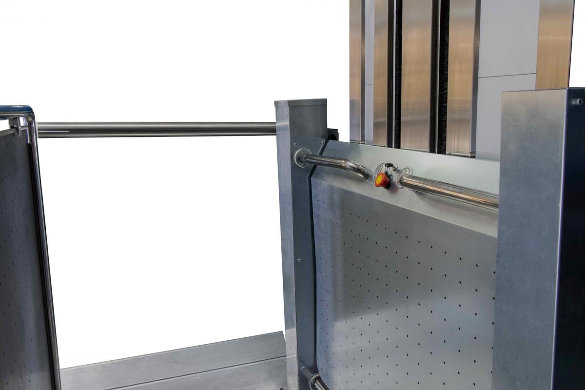 Detail of the platform lift with stainless handrail and emergency stop