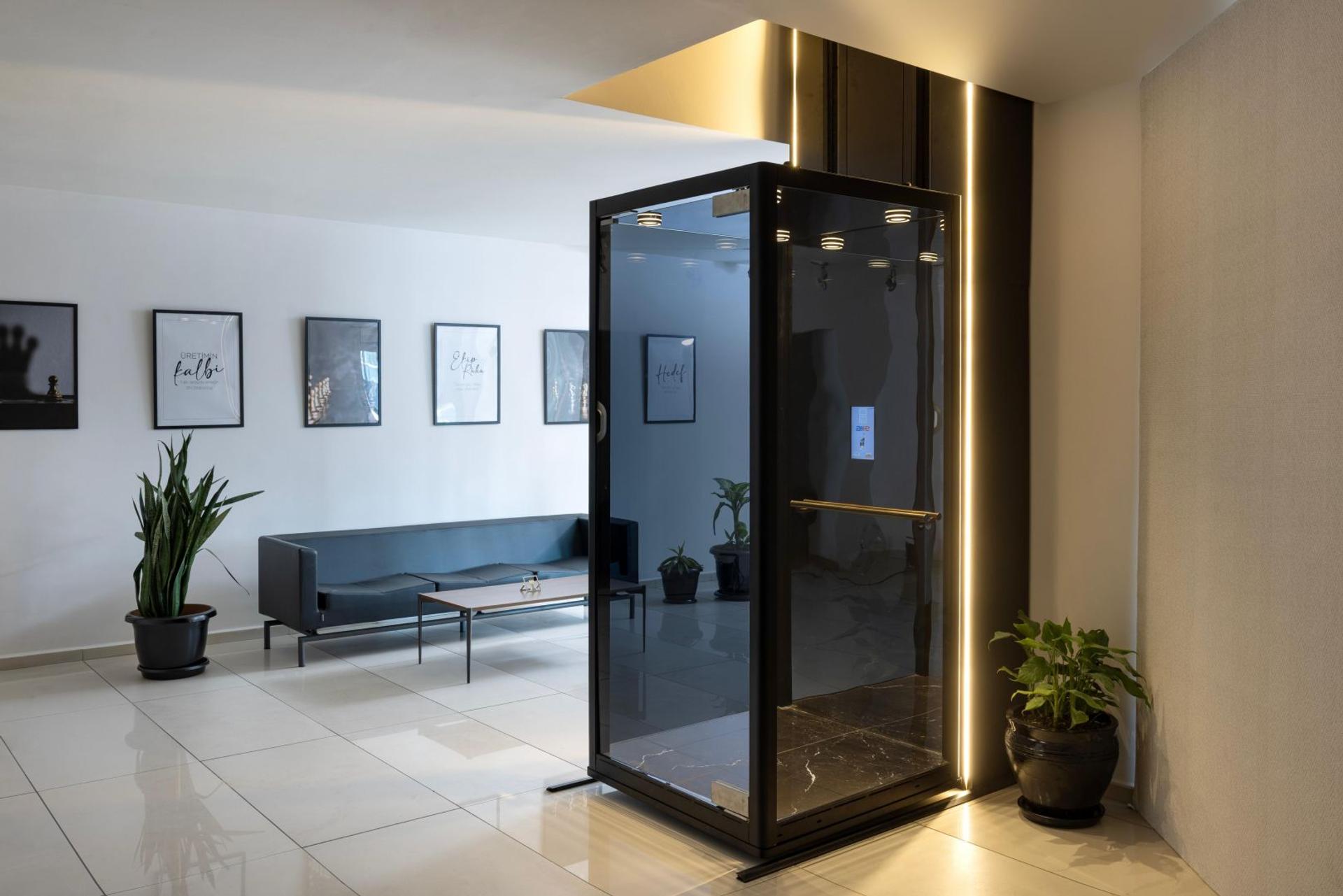 AKE home lift with glass cabin providing residential vertical mobility
