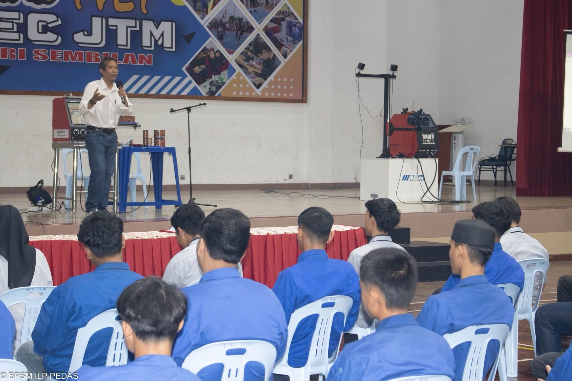 Presenter addressing students during the industrial skills seminar at ADTEC JTM Kampus Pedas